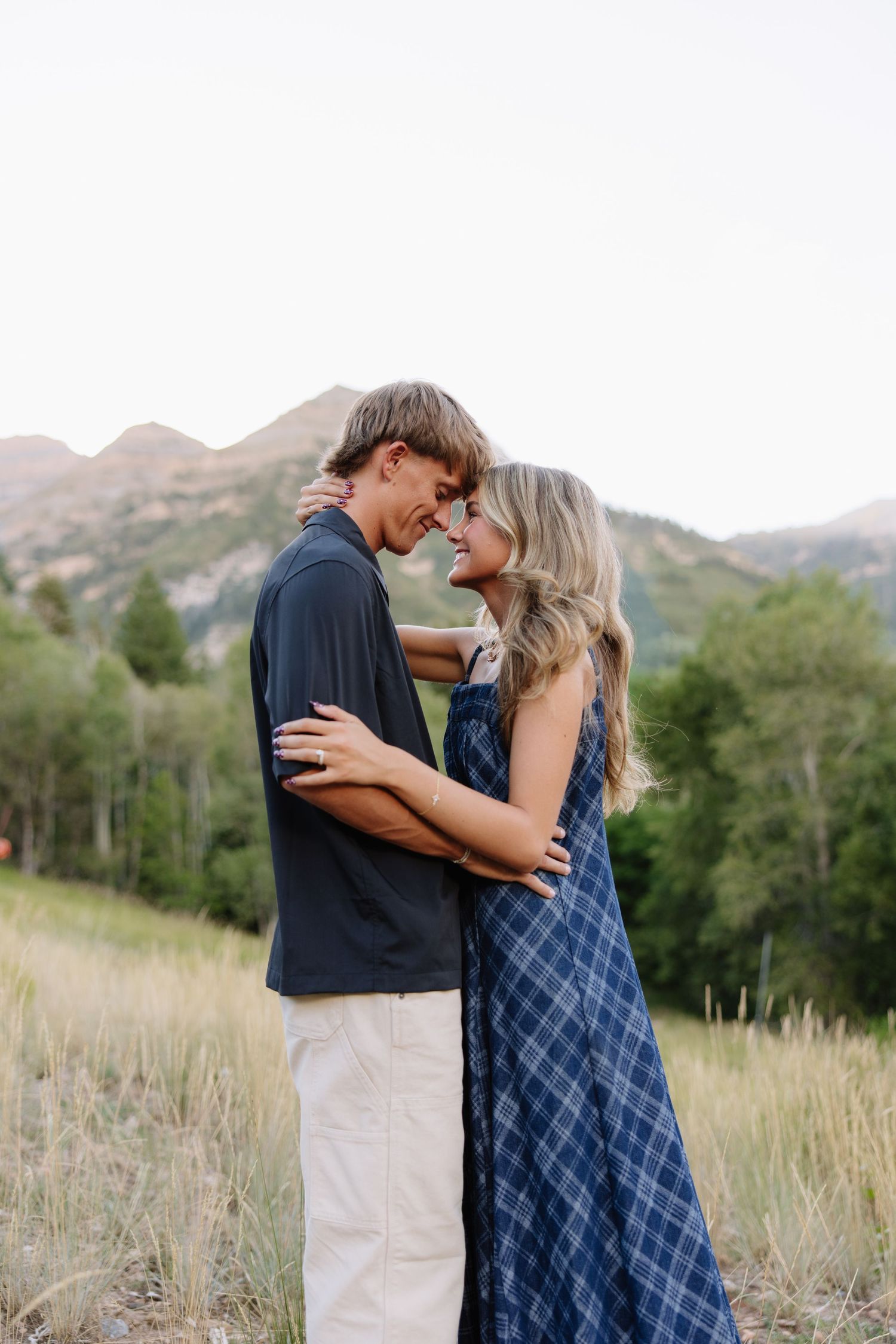Utah wedding photographer capturing an emotional first look between a bride and groom surrounded by beautiful mountain scenery.
