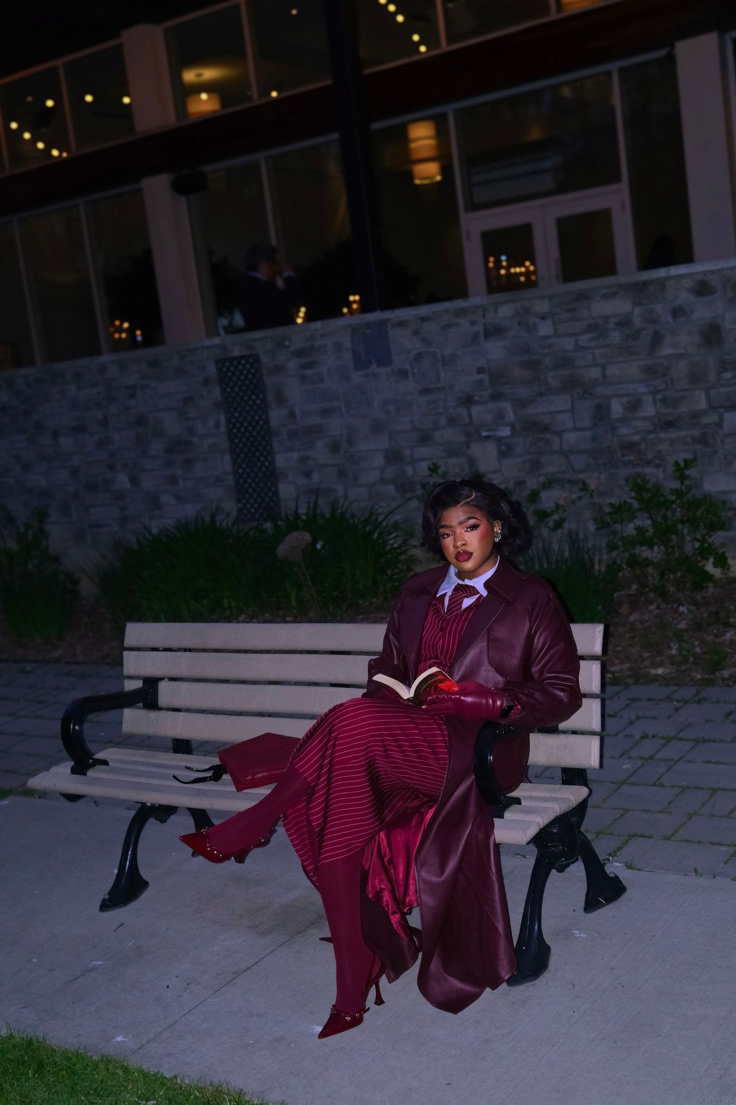 lady in burgundy sitting down