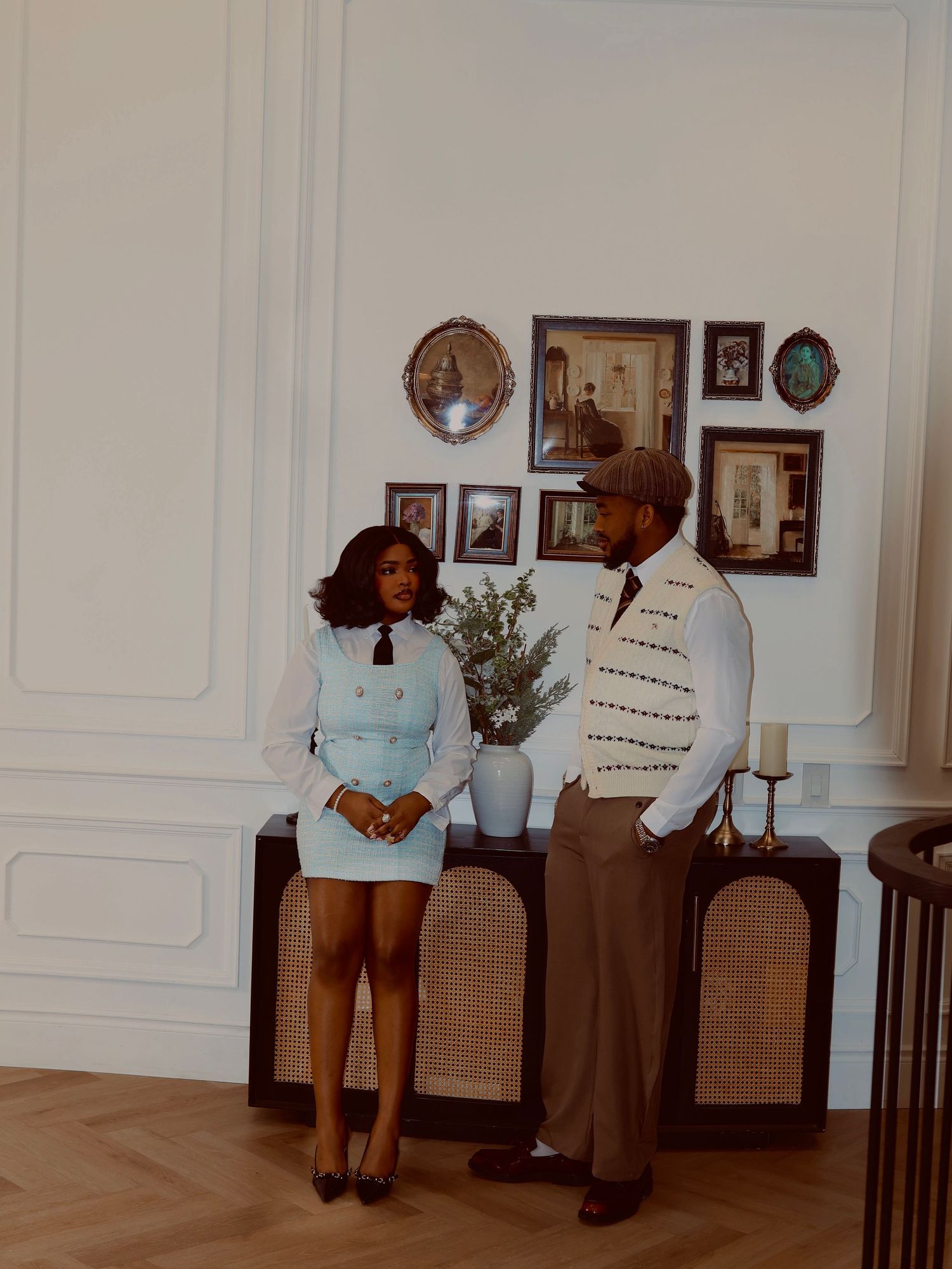 two people posing in a room,