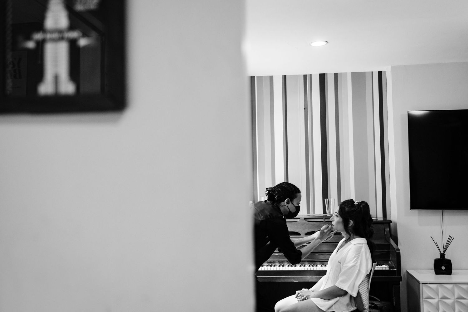 Black and white interior shots of a modern room with piano and natural lighting.