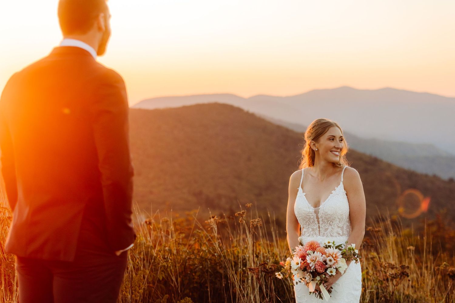 Golden hour wedding portraits with dramatic mountain ranges in the background.