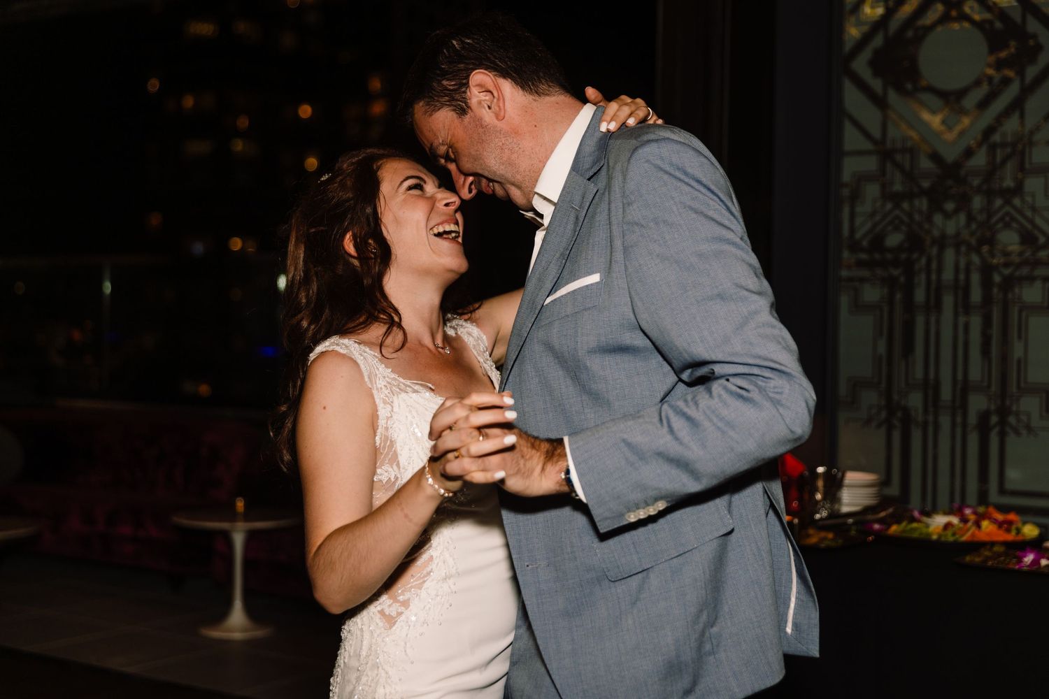 Couple sharing an intimate dance moment at their wedding reception.