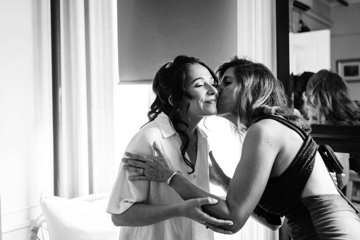 Black and white intimate moments captured during wedding preparation.