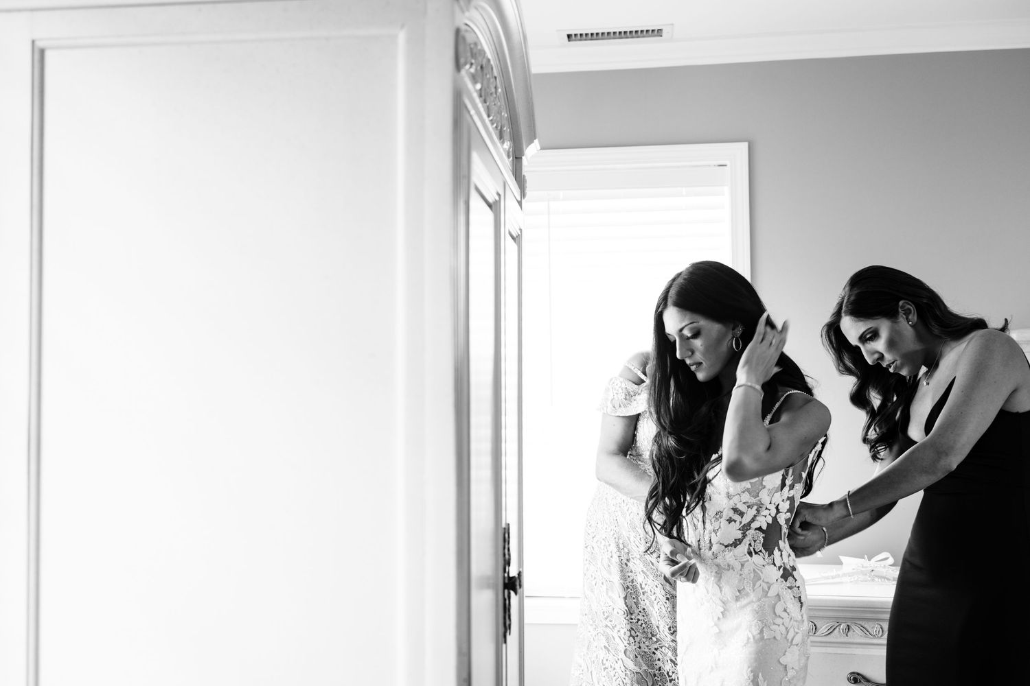 Black and white photo showing preparations in getting ready room.