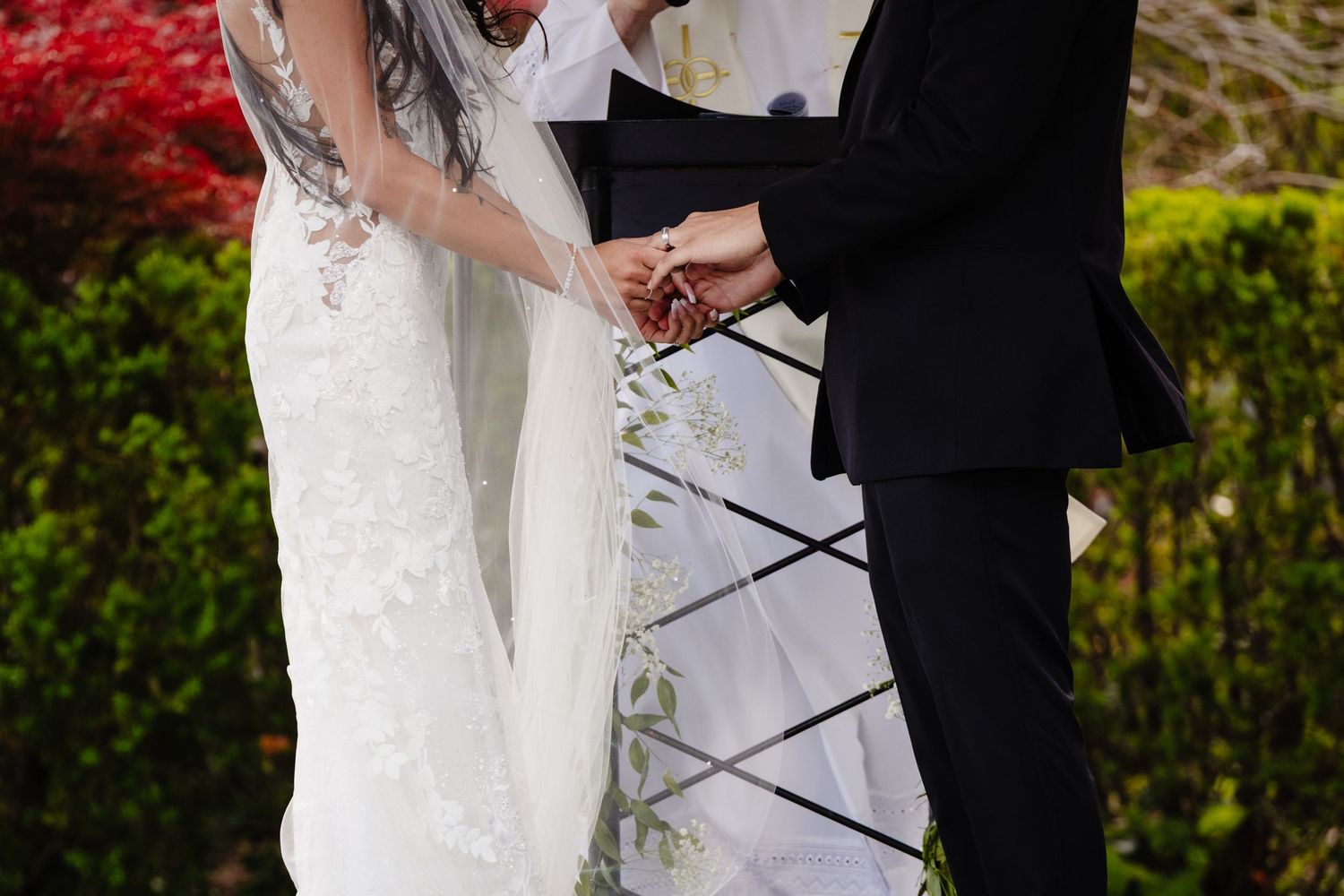 Couple shares a romantic moment during their outdoor wedding ceremony.