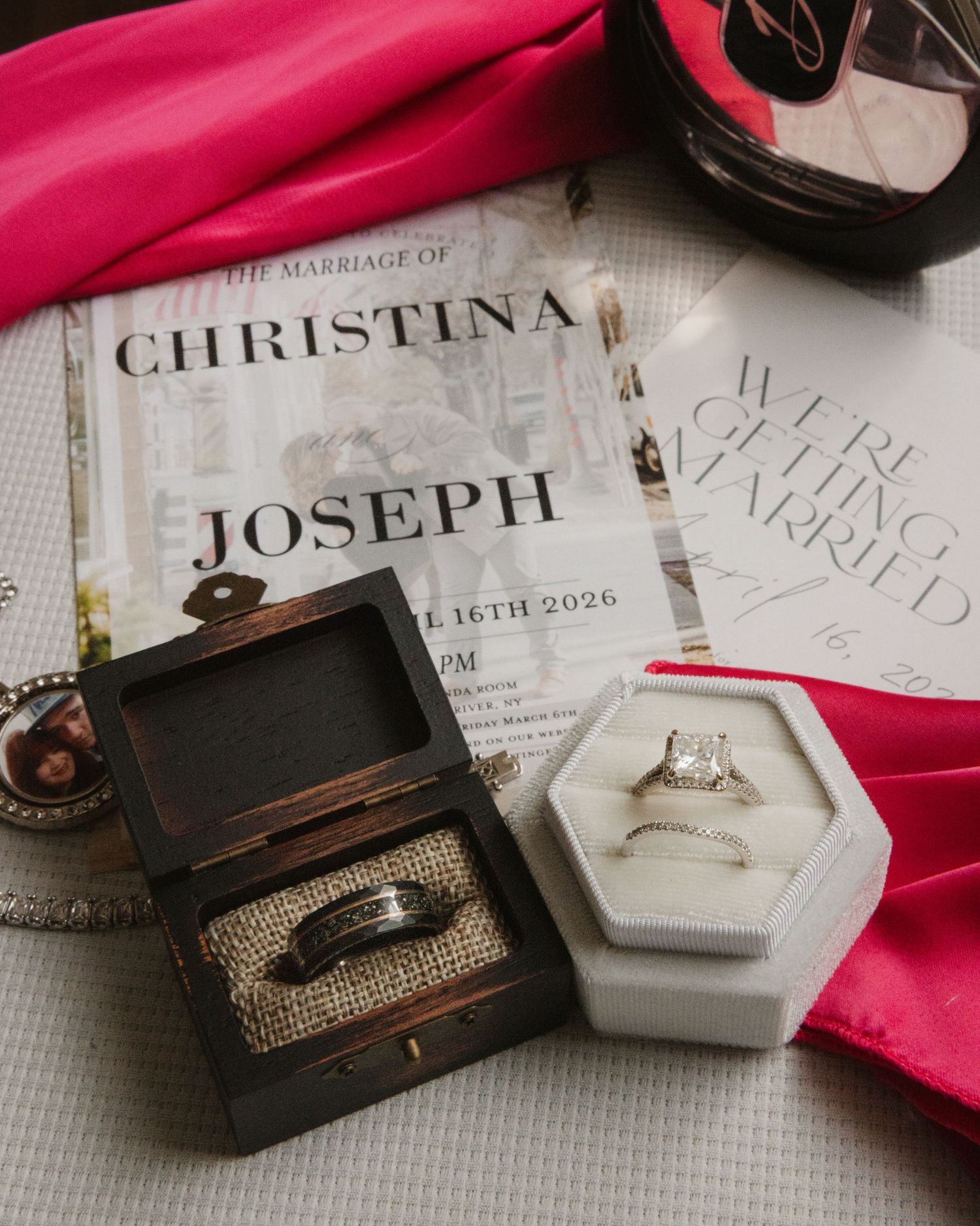 Wedding rings, invitations, and accessories flat lay for Christina and Joseph's marriage celebration.