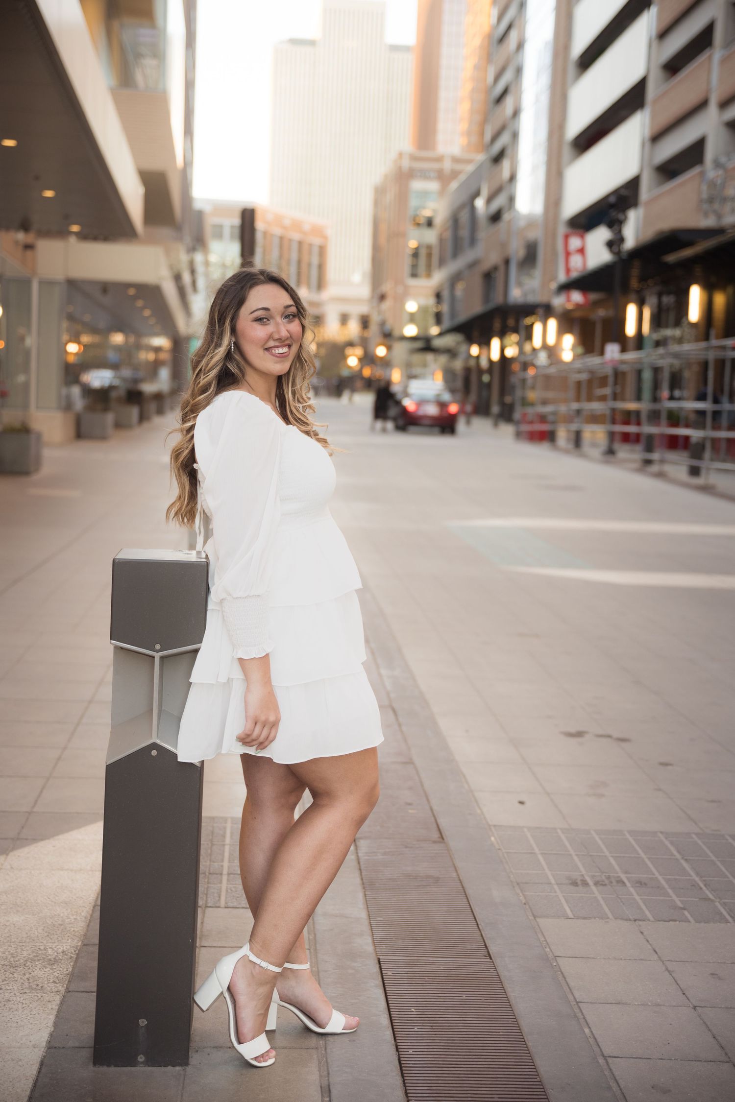 High school senior girl posing during an urban senior photography session in downtown Salt Lake City, Utah.