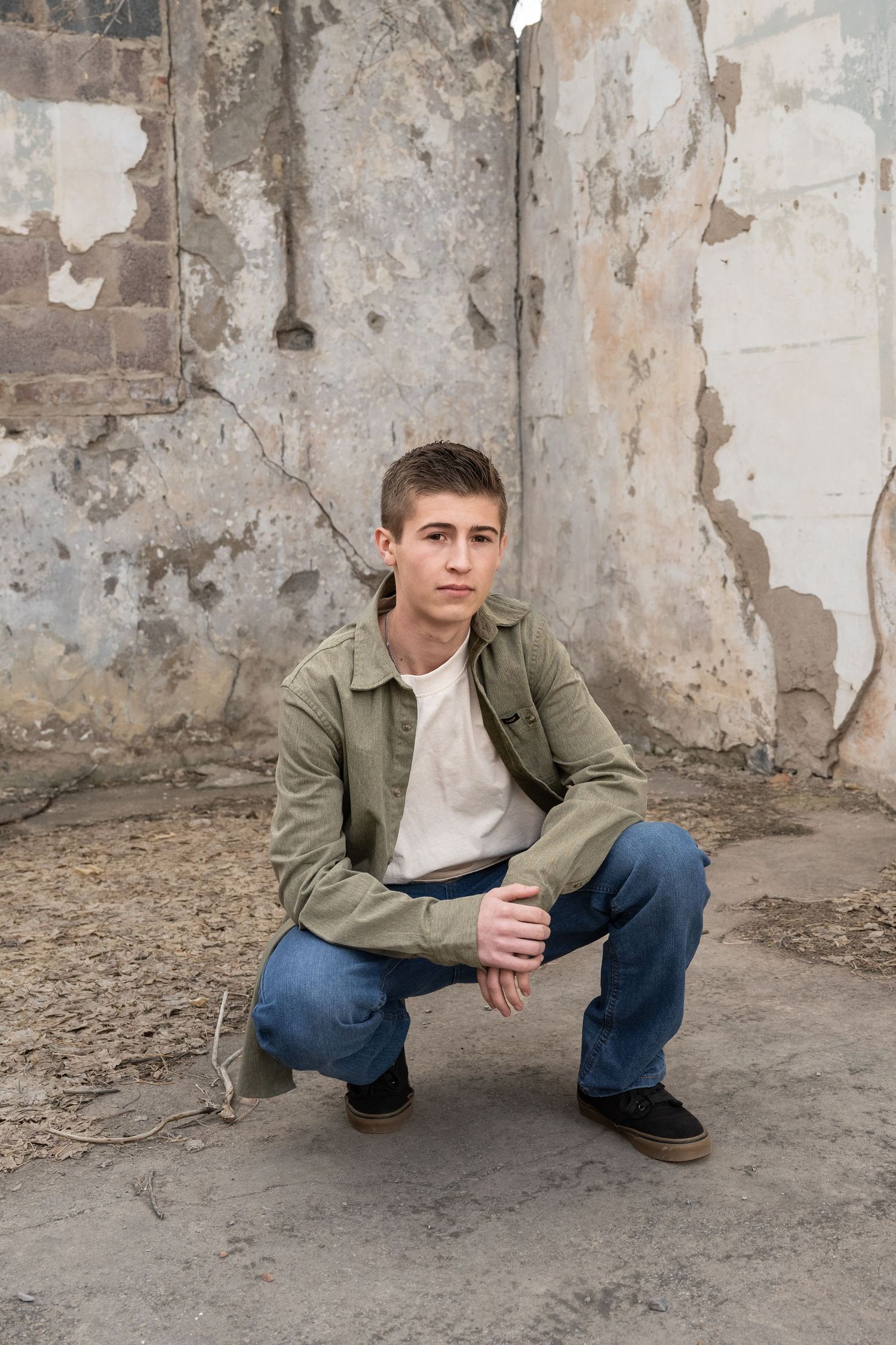 High school senior boy posing outdoors during a senior photography session in Eureka, UT.