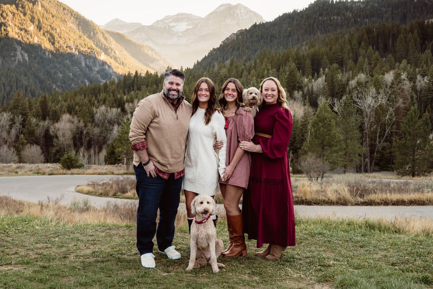 Family of five with their dog enjoying a mountain family photography session surrounded by beautiful Utah scenery.