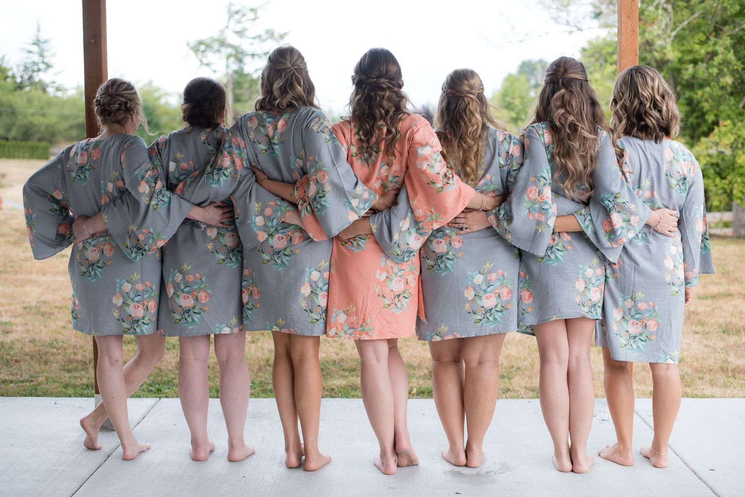 Bridal party portrait featuring bridesmaids in matching robes before the wedding ceremony.