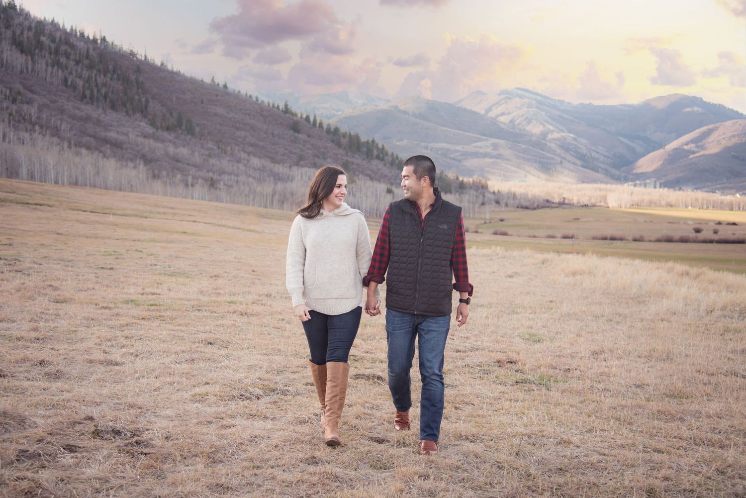 Couple walking together during an outdoor engagement photography session in Park City, UT.