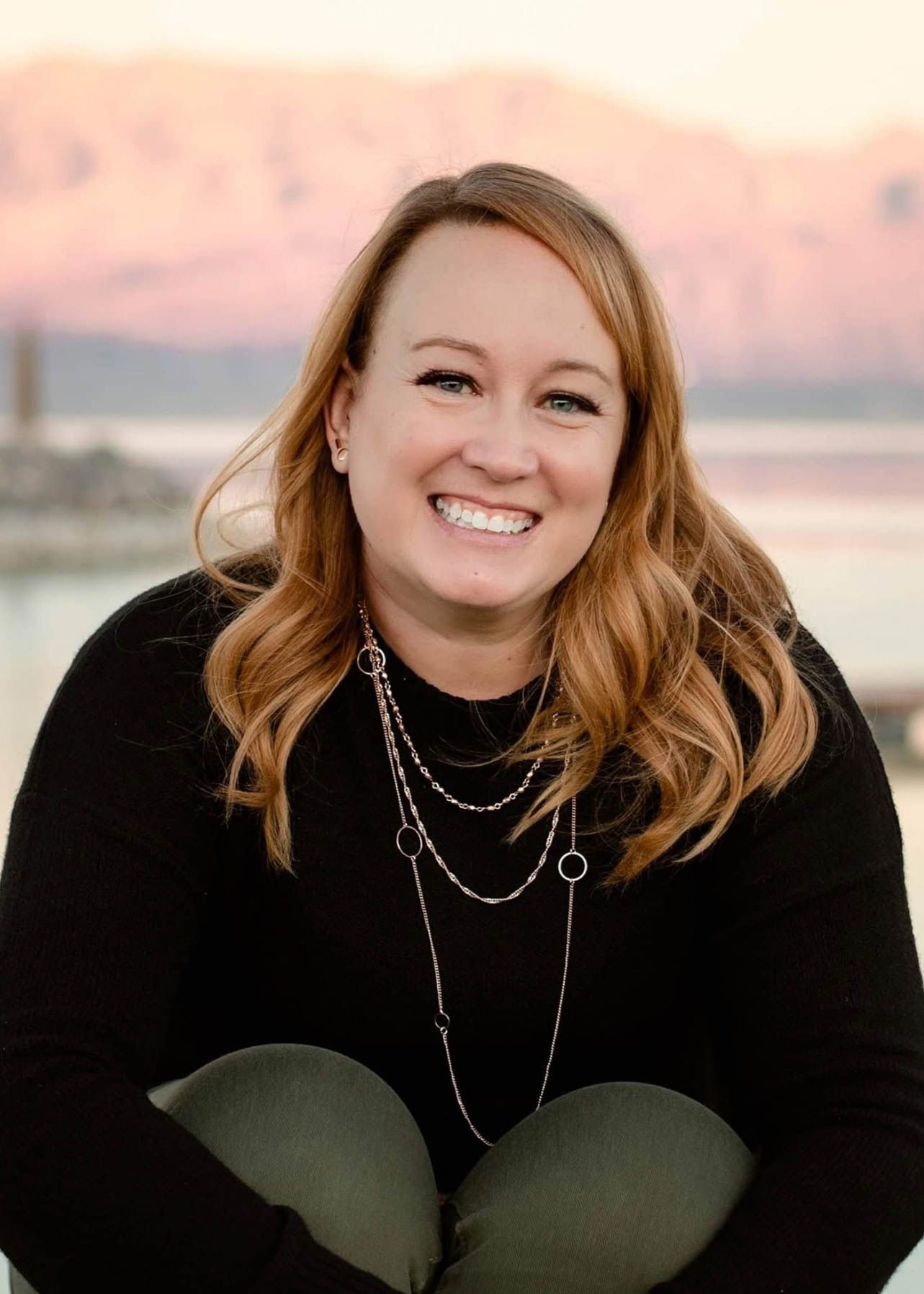Professional headshot of Jen Verbeck, photographer specializing in seniors, families, and weddings in Utah County.