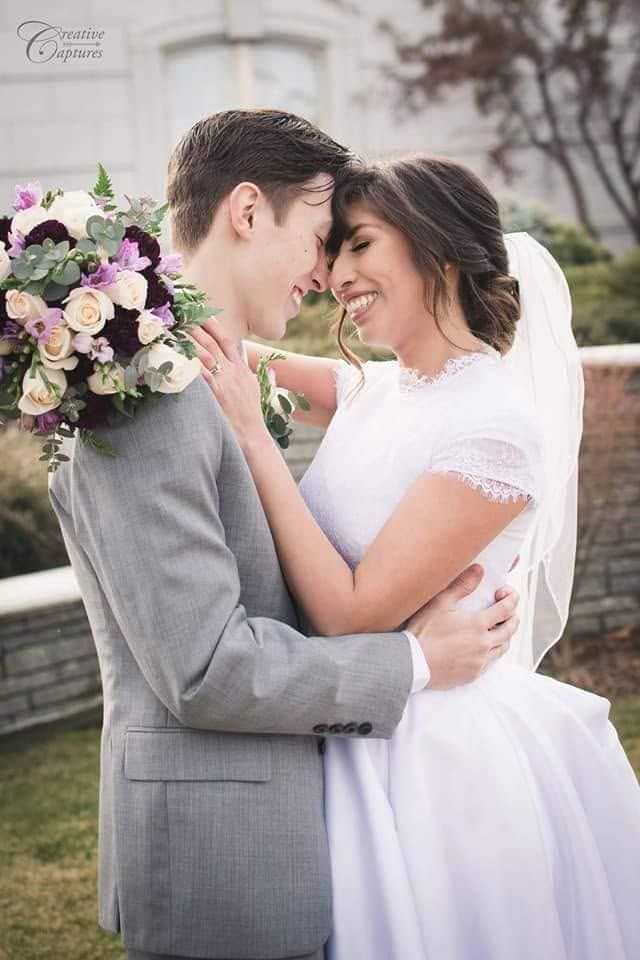 Bride and groom sharing a romantic embrace during their outdoor wedding portrait in Washington.