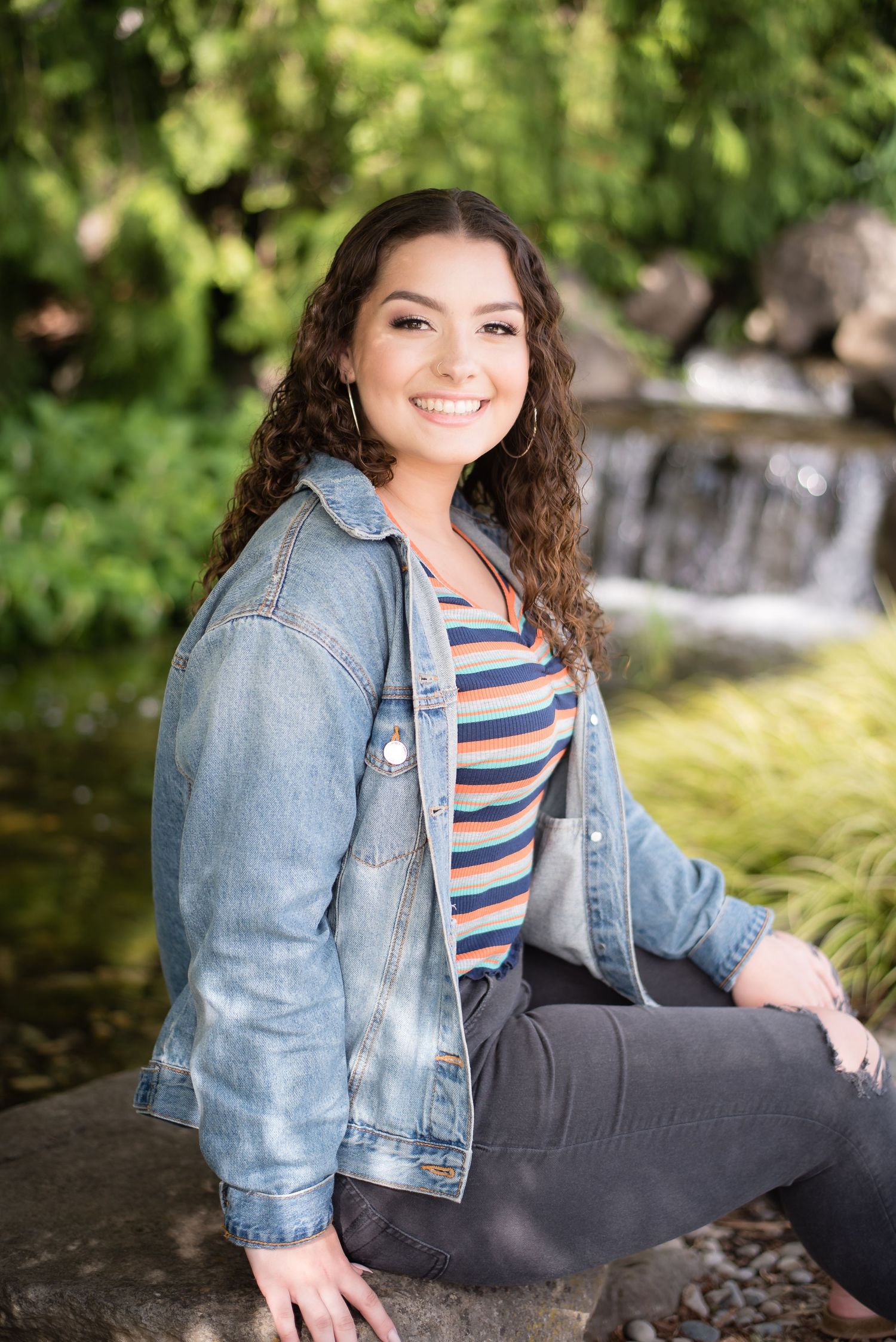High school senior girl smiling during an outdoor senior photography session in Clark County, WA.