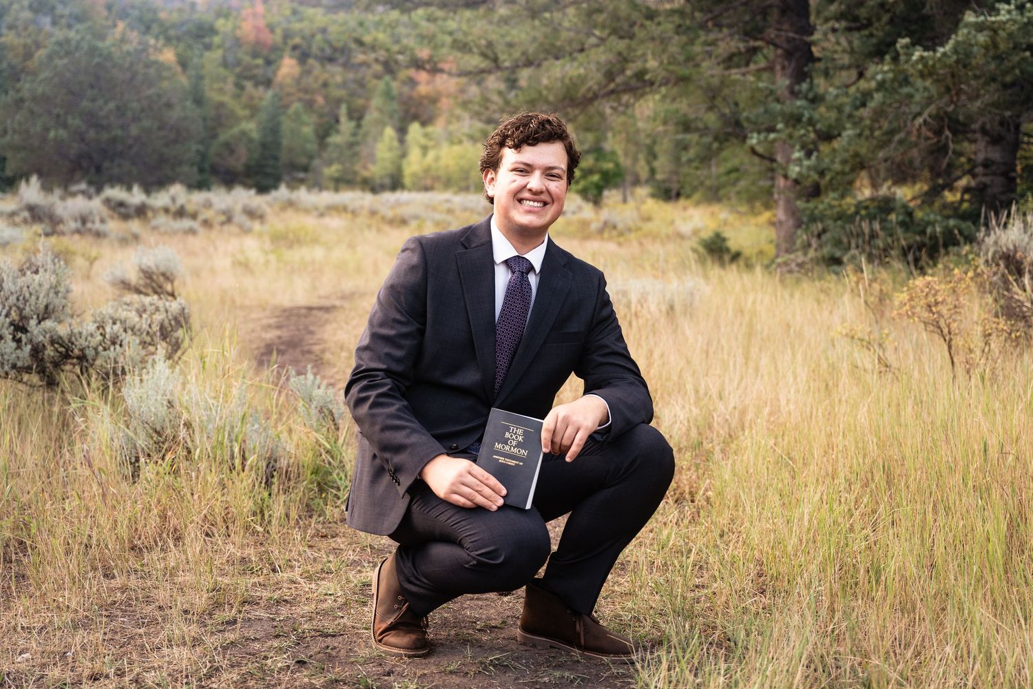 Outdoor LDS missionary portrait in a scenic Utah field before departing to serve a mission.