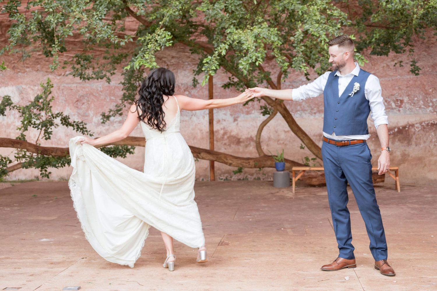 Newly married couple sharing their first dance during an outdoor Utah wedding celebration.
