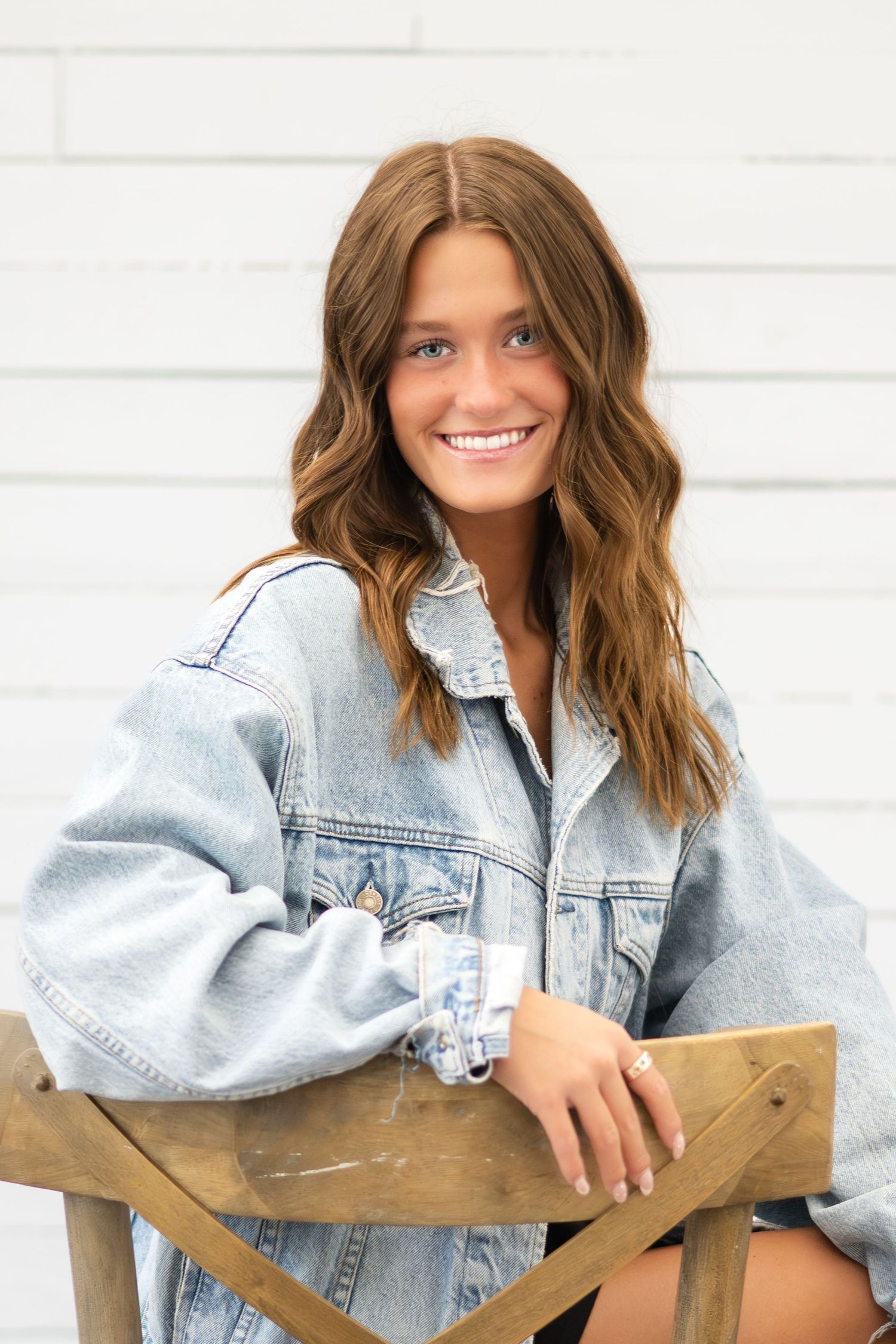 Natural light branding portrait featuring a young woman in a relaxed indoor setting.