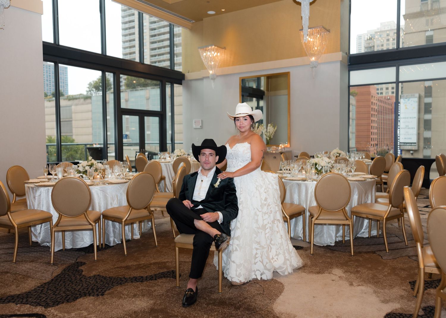 Elegant wedding reception venue with round tables and chairs set up in a modern space.