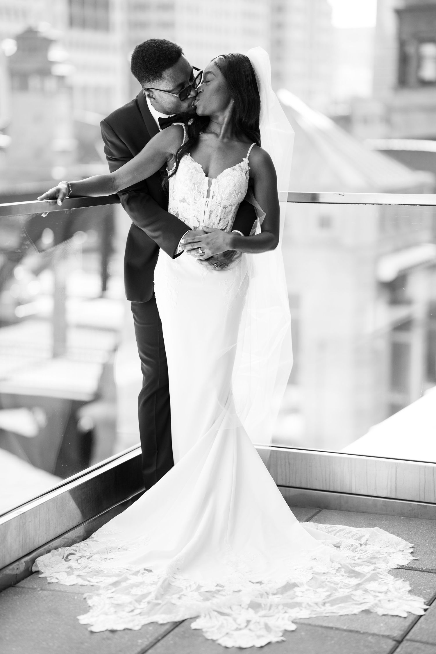 Artistic black and white wedding portraits showing romantic dips and embraces.