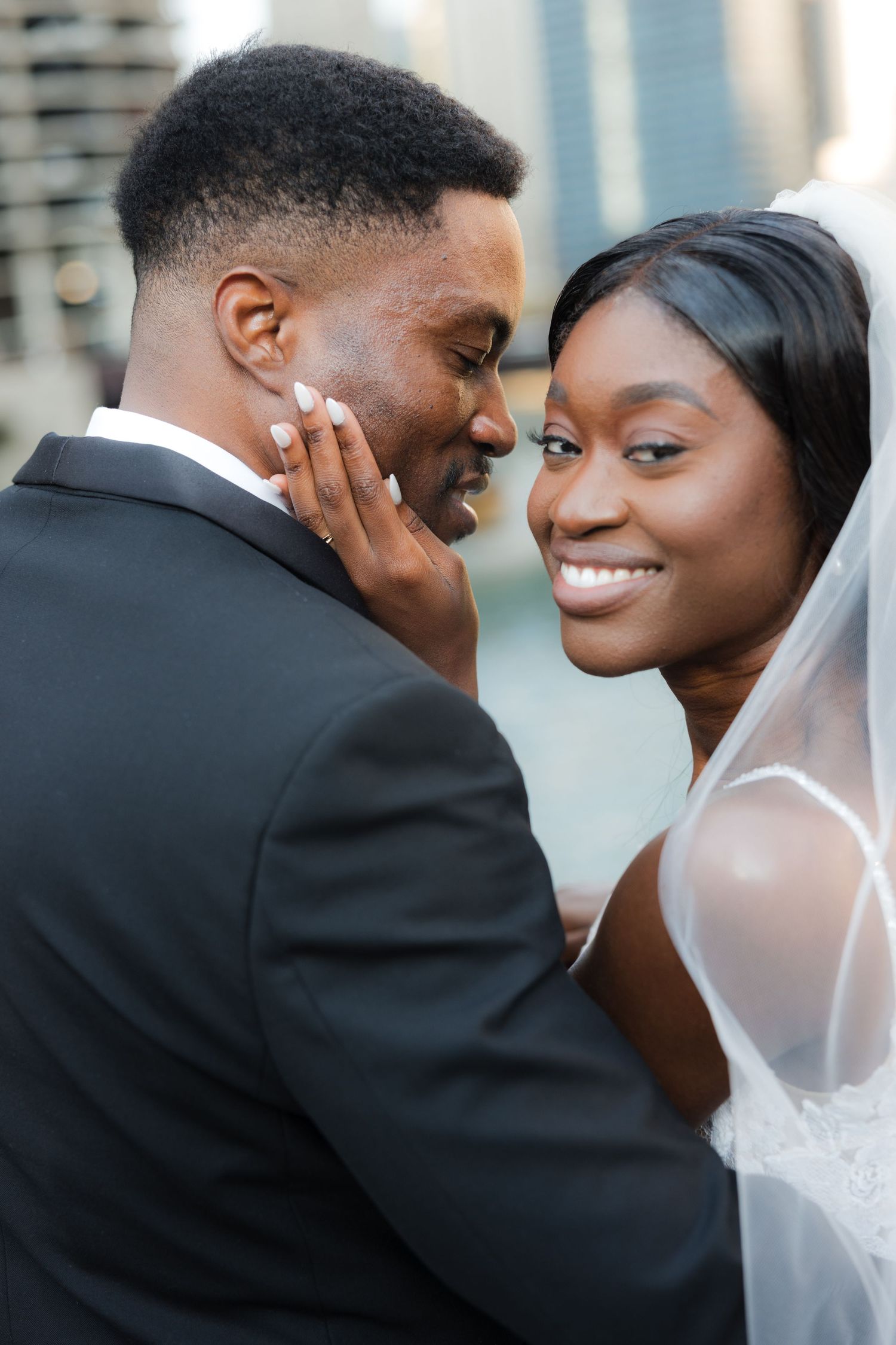 Romantic close-up portraits of couple sharing tender moments during wedding photoshoot.