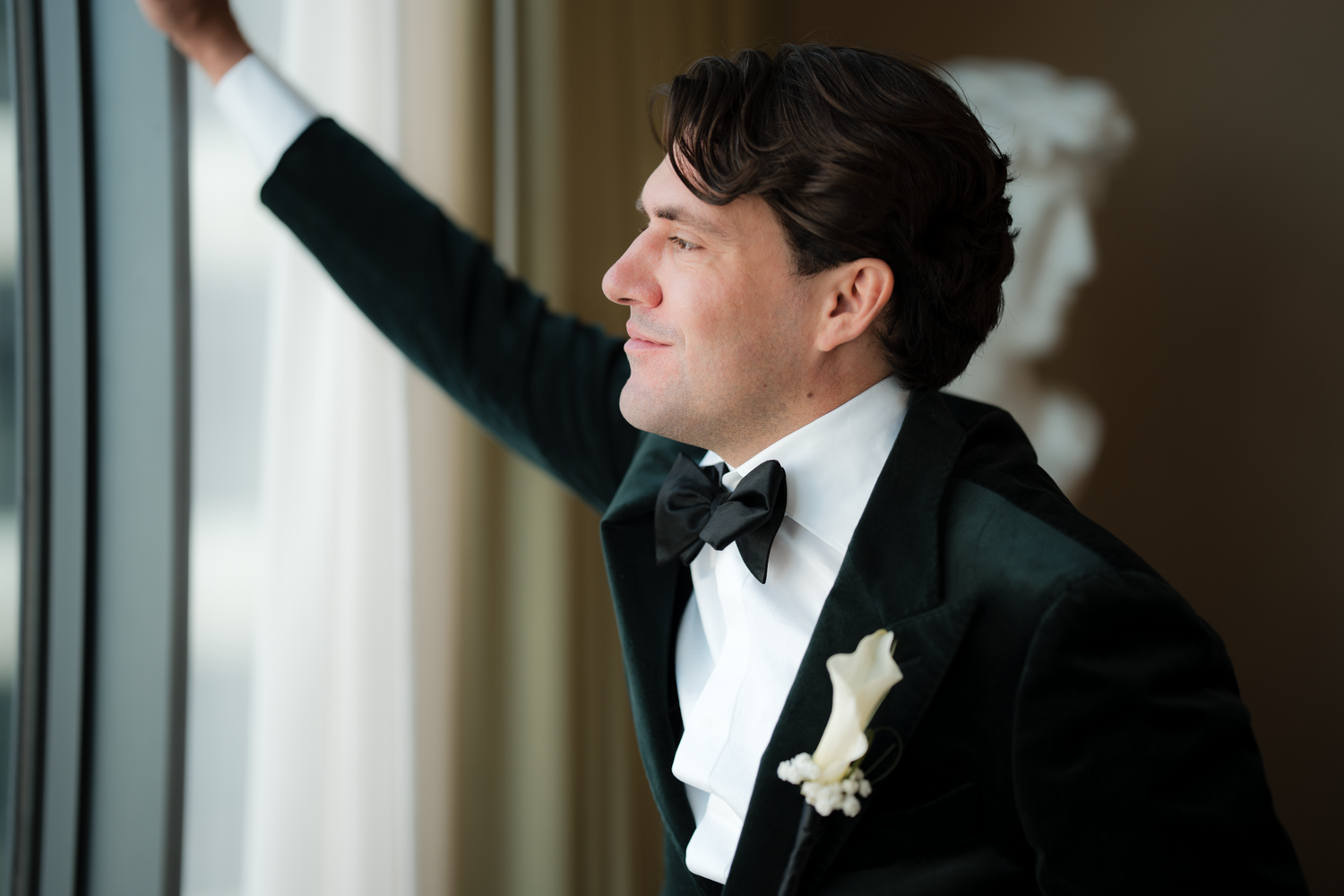 Silhouette of person in formal wear against window creating dramatic poses.