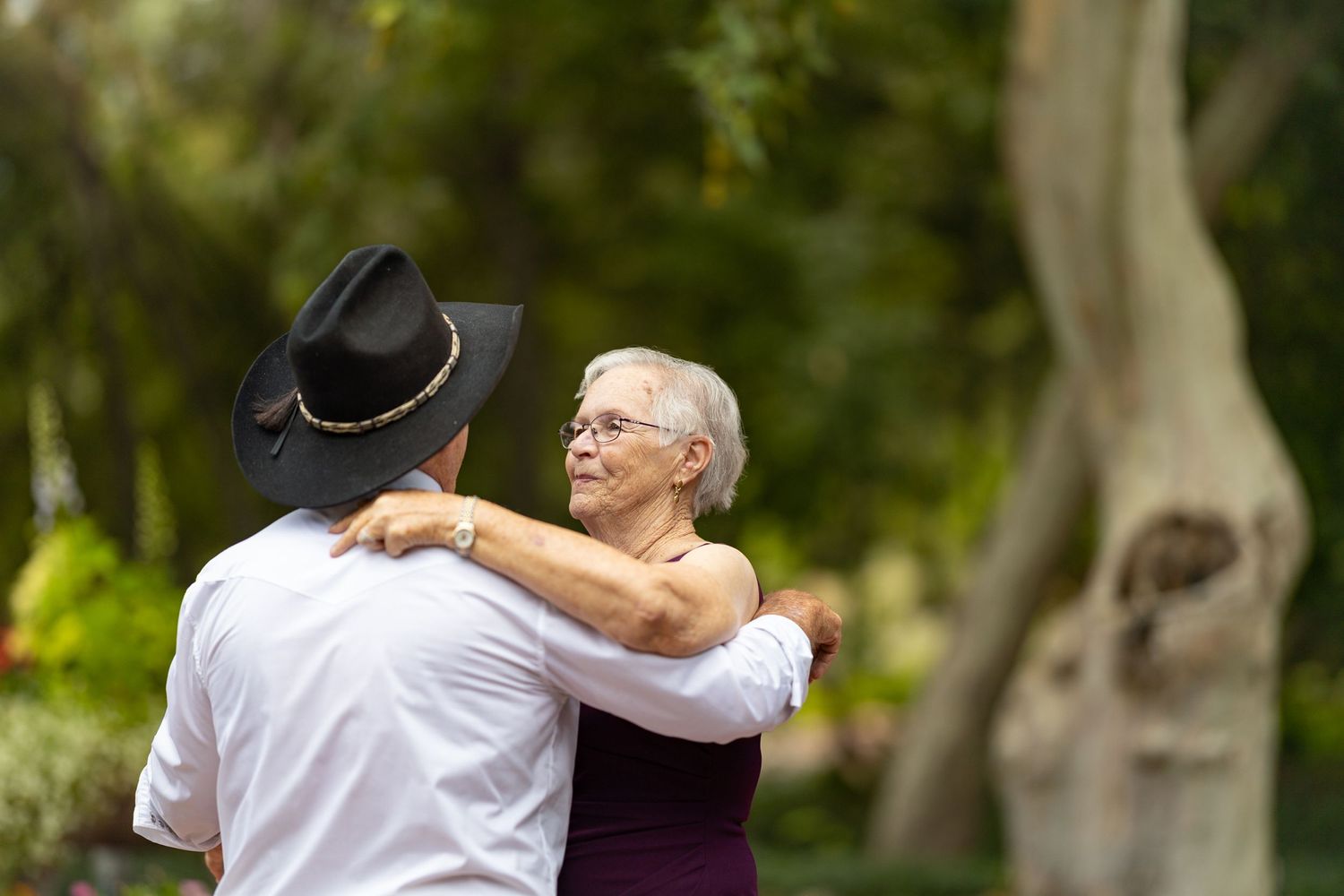 Wedding couple dancing together on their wedding day.