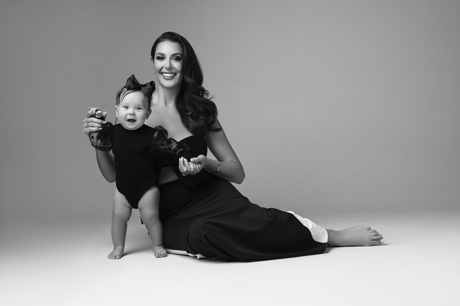 A black and white photo of a woman and her daughter