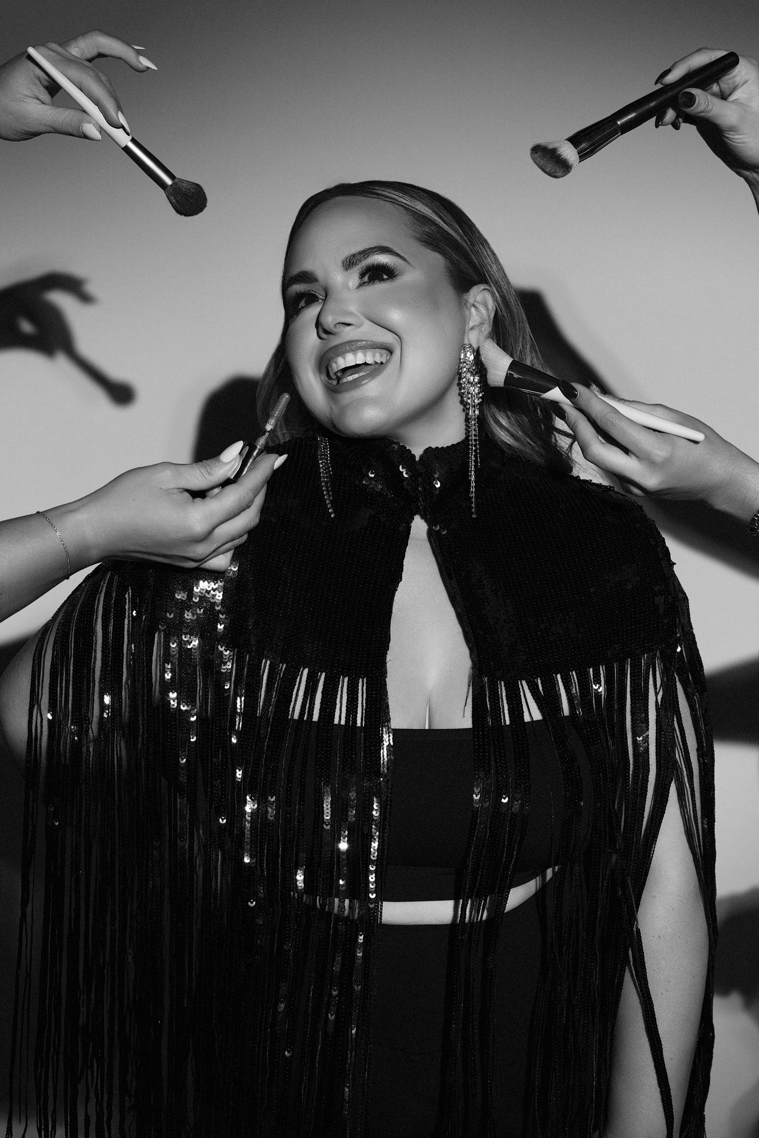A black and white photo of a woman promoting her makeup skills