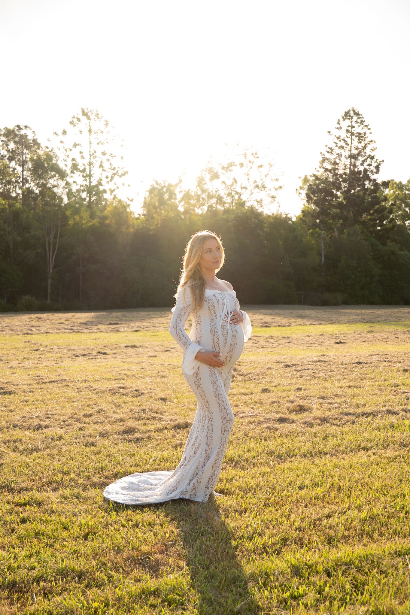 Expecting mother in white dress at golden hour in open field Maternity session — Photos by Bailey Rose Gold Coast