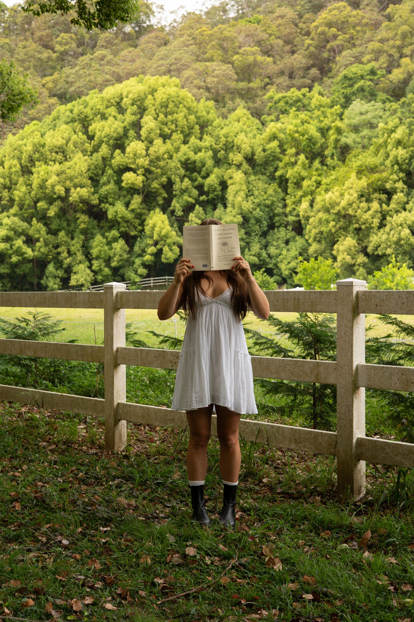 Outdoor creative solo portrait standing holding book in front of face - Photos by Bailey Rose Gold Coast