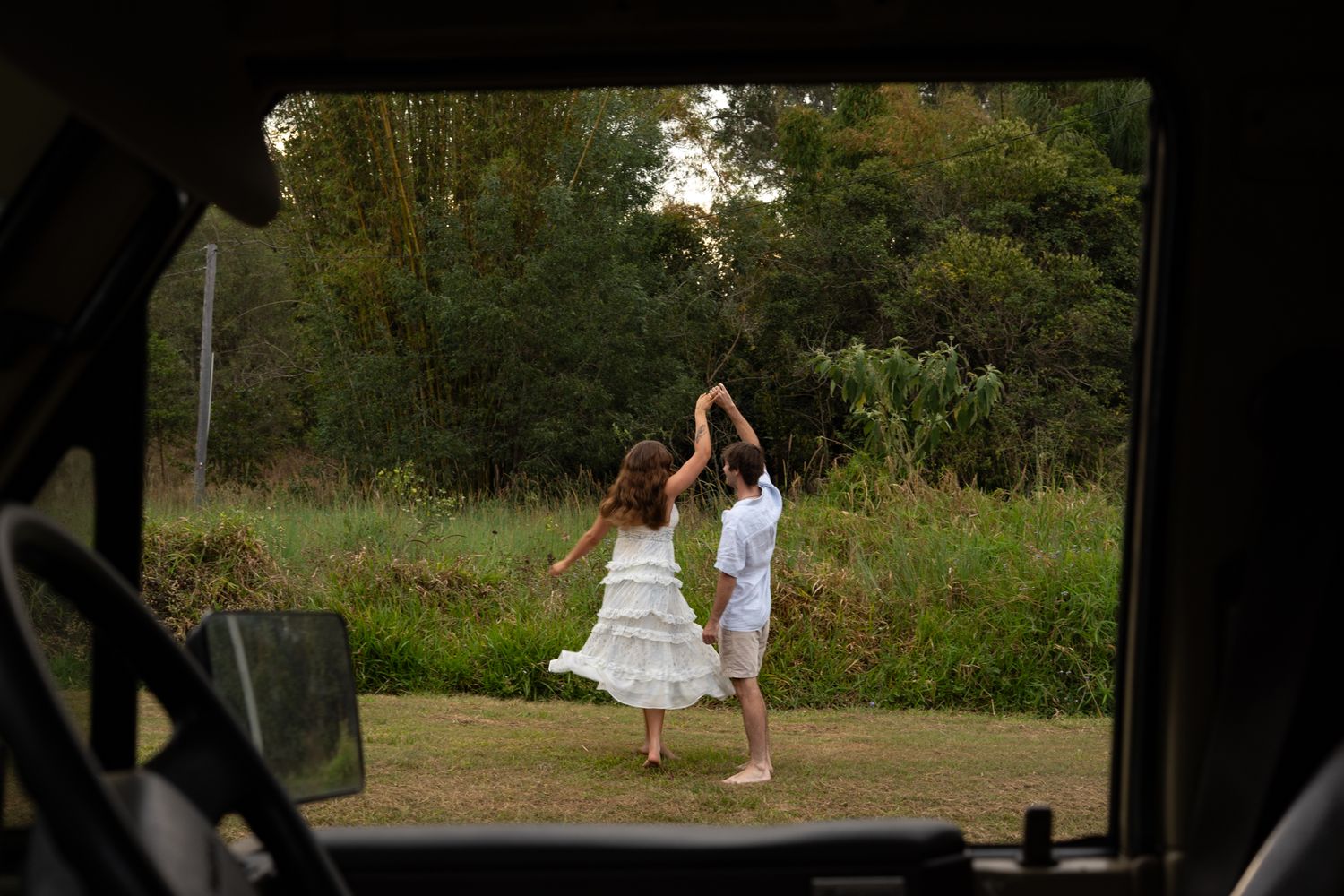 Couple dancing and laughing in open field — Photos by Bailey Rose Brisbane