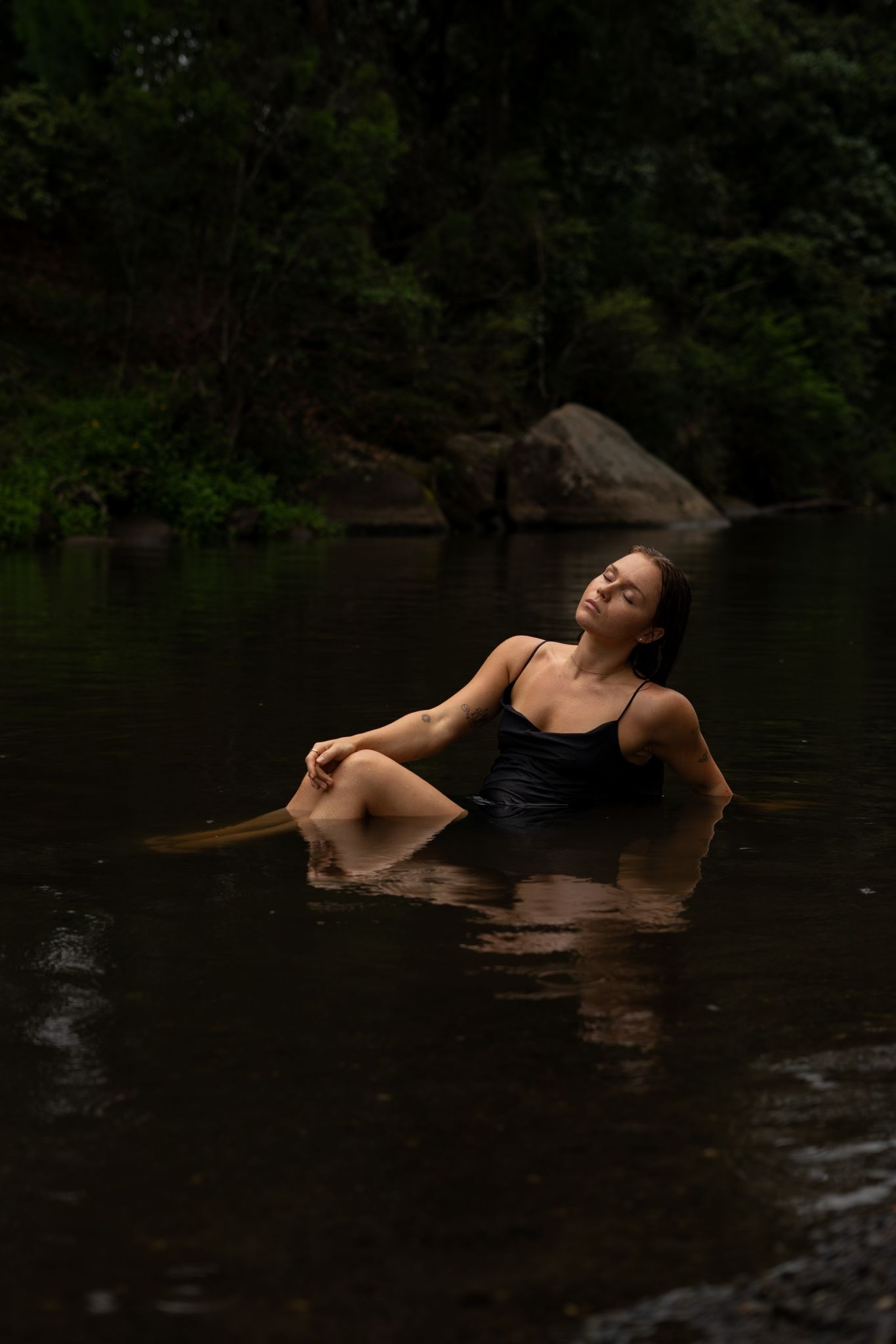 Photos by Bailey Rose — moody water sitting portrait in dark setting
