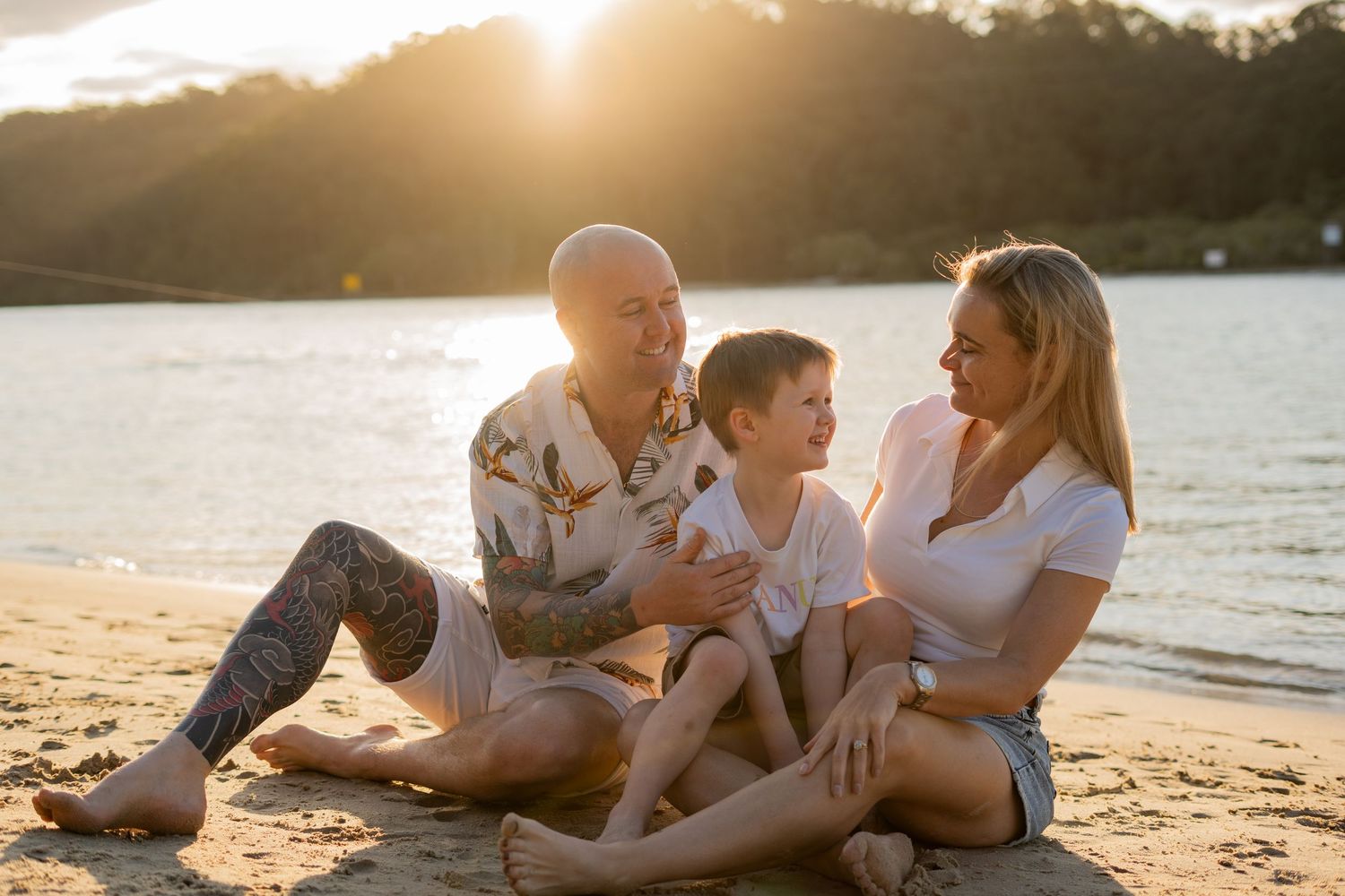 Family laughing together on the beach, unposed family portrait - Photos by Bailey Rose Gold Coast
