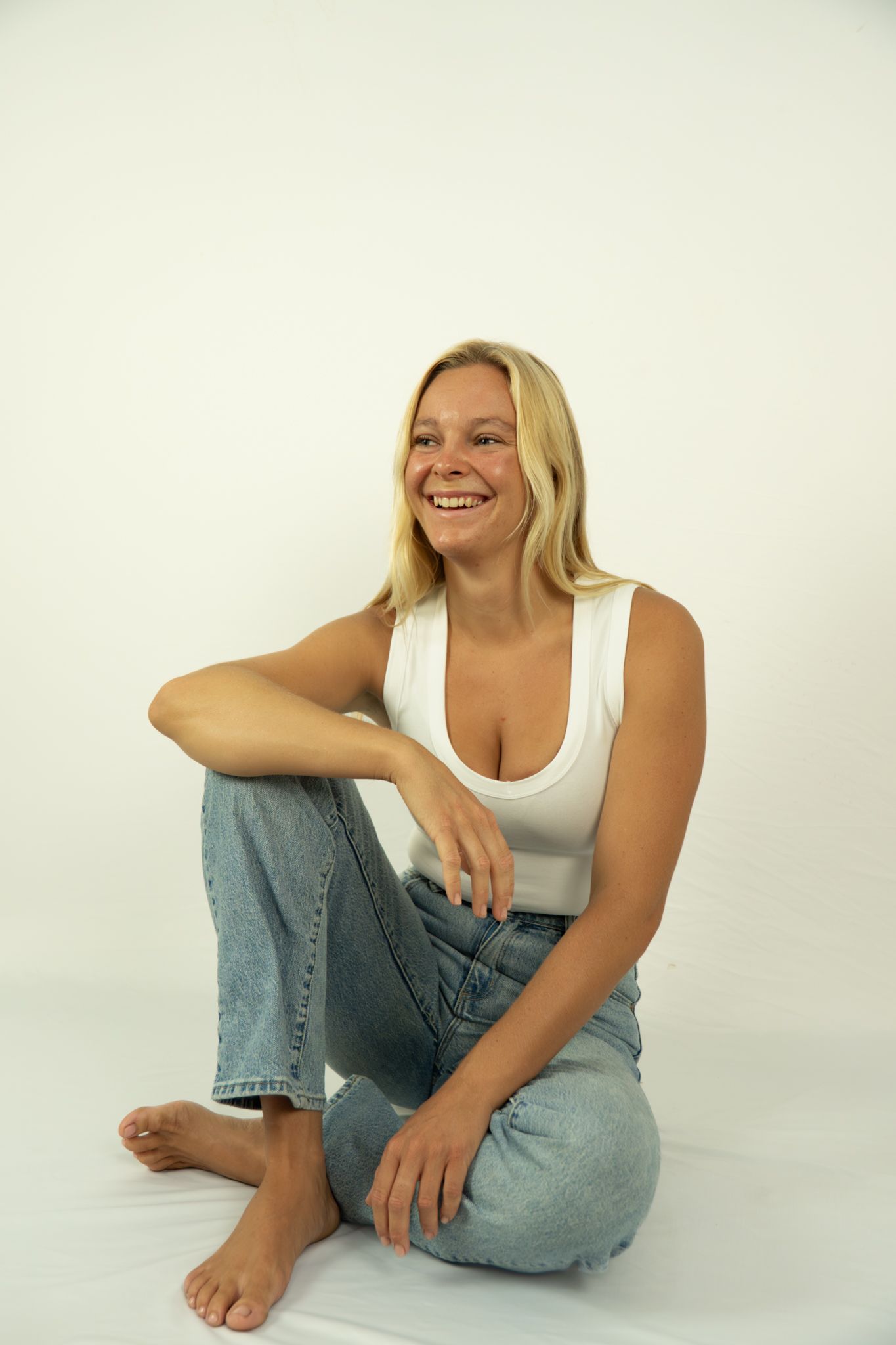 Relaxed portrait in white top and jeans for modelling portfolio, home studio - Photos by Bailey Rose Brisbane