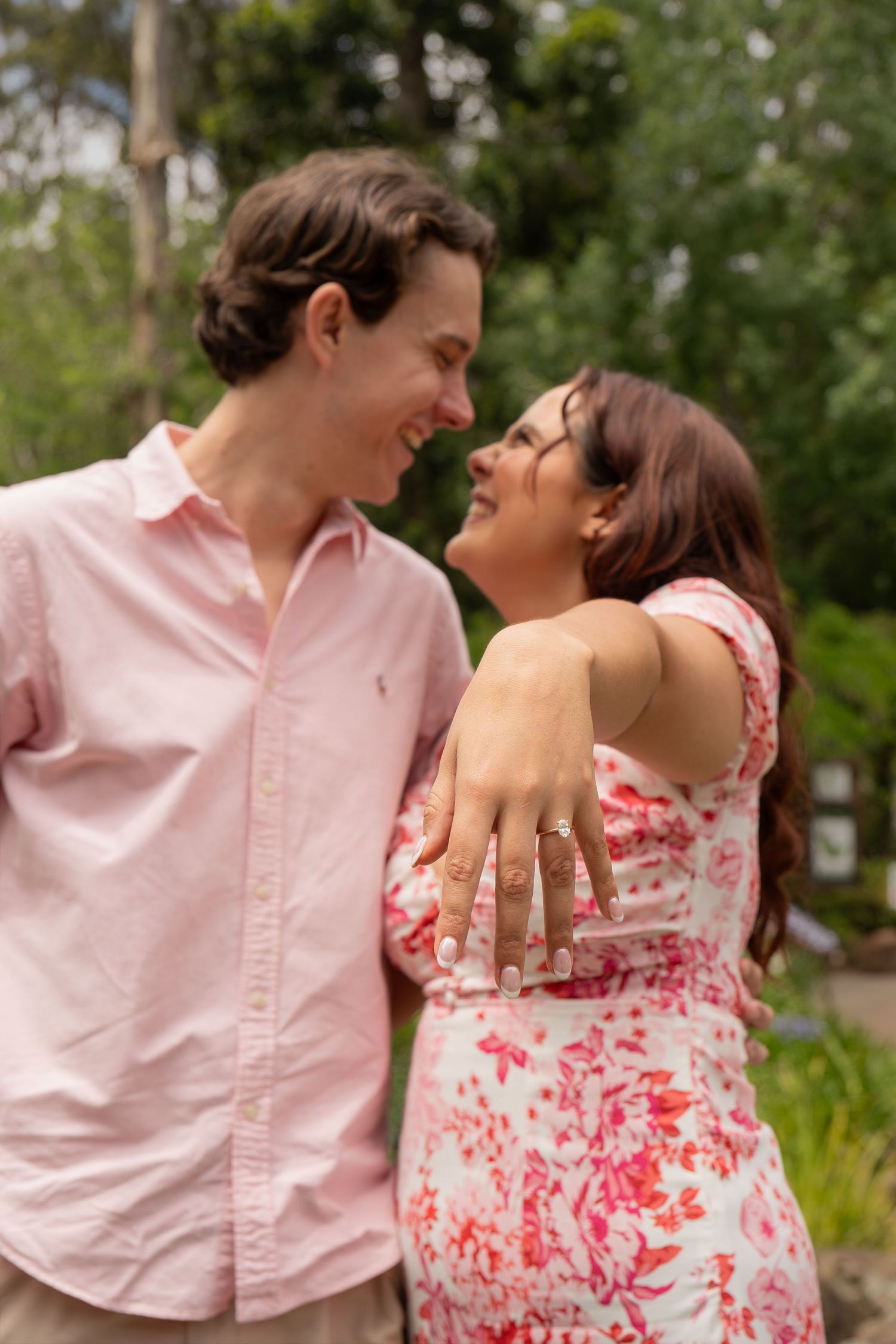 Couple just engaged showing off ring with greenery in the background - Photos by Bailey Rose Gold Coast