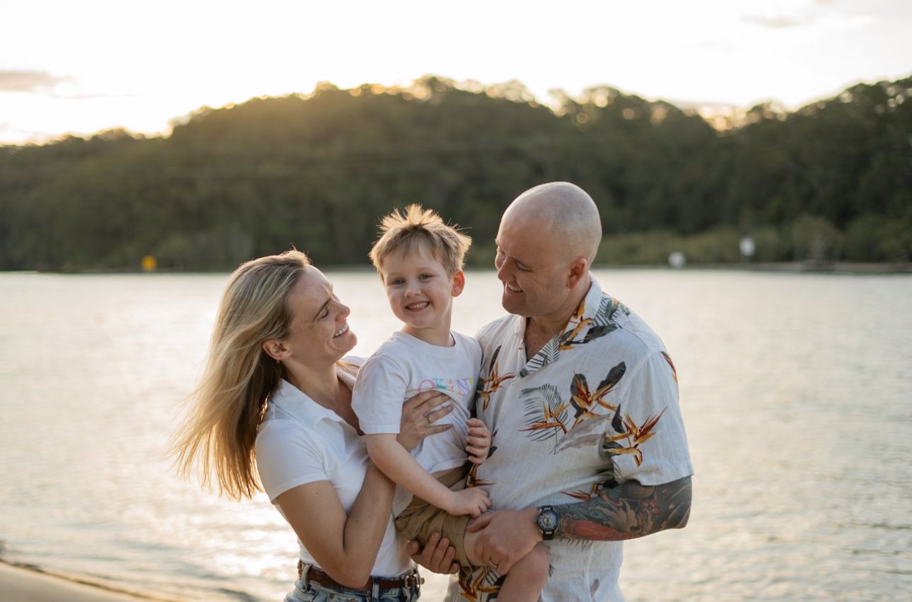 Family laughing together on the beach, unposed family portrait - Photos by Bailey Rose Gold Coast