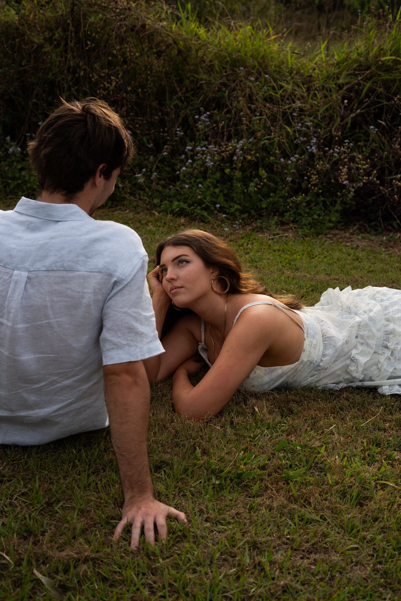 Couple lying in grass together at golden hour — Photos by Bailey Rose Gold Coast