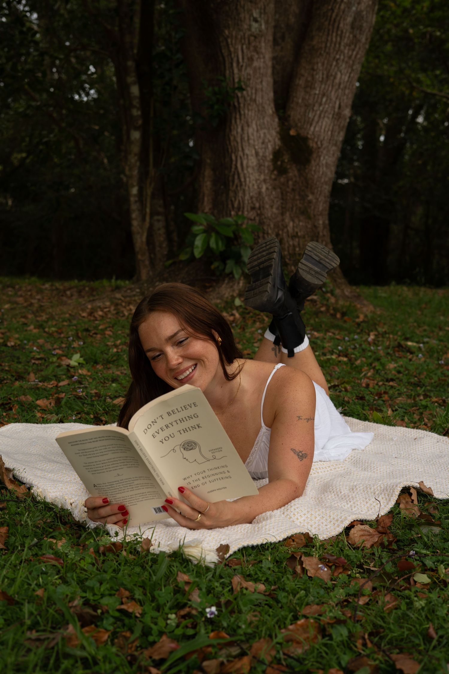 Solo creative portrait in lush greenery laying on picnic blanket — Photos by Bailey Rose Gold Coast