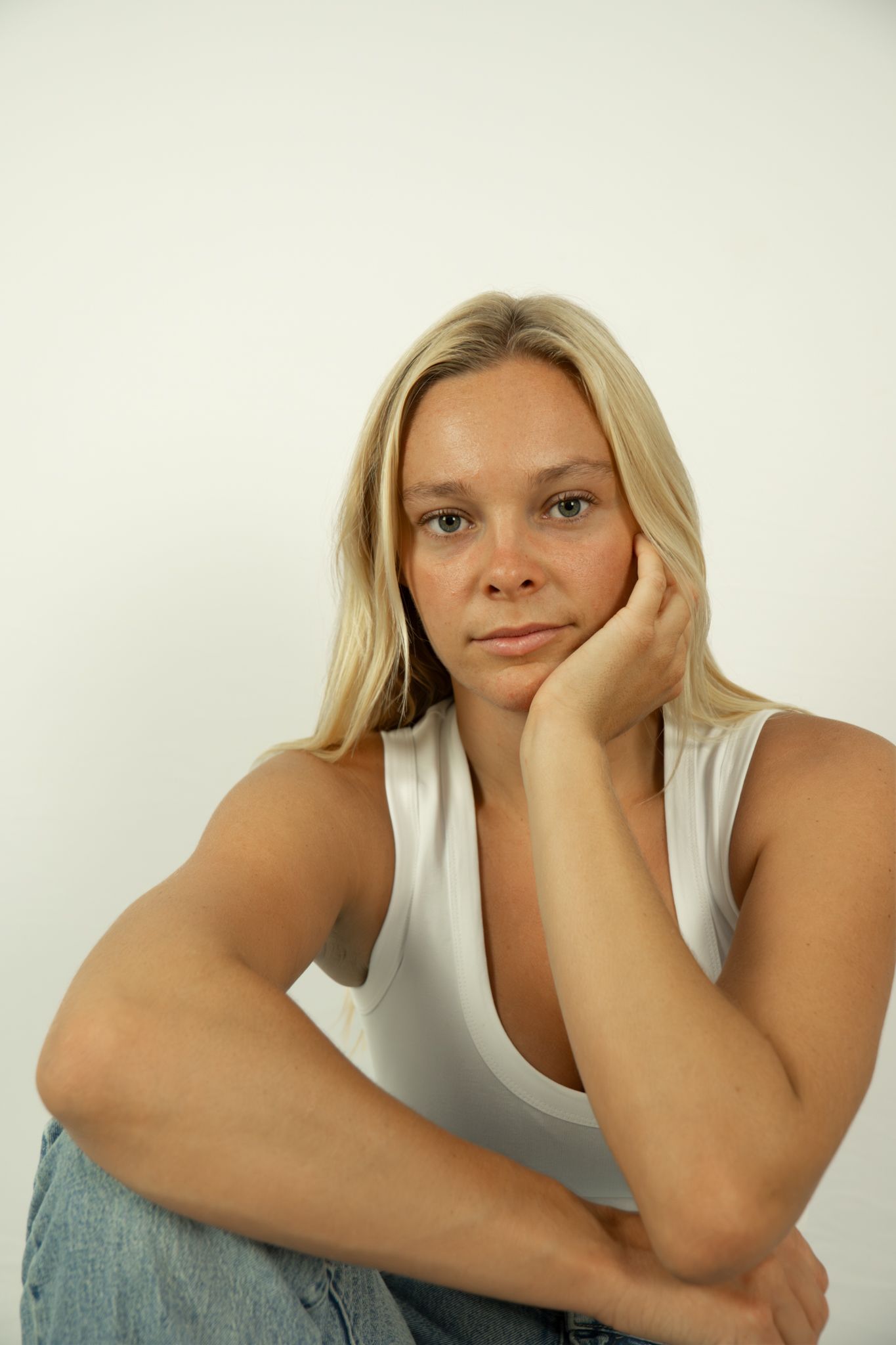 Relaxed portrait in white top and jeans for modelling portfolio, home studio - Photos by Bailey Rose Brisbane
