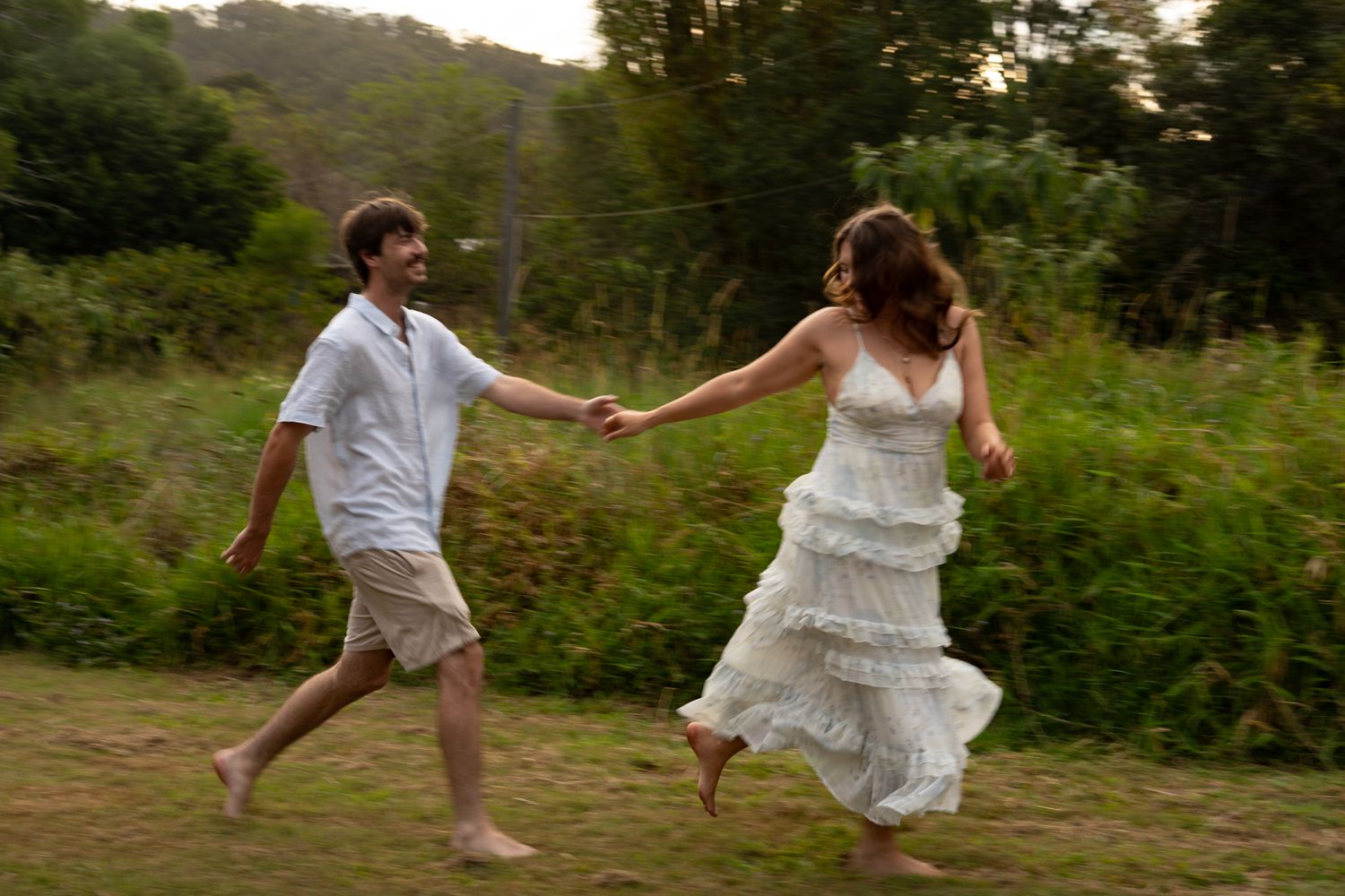 Couple dancing and laughing in open field — Photos by Bailey Rose Brisbane
