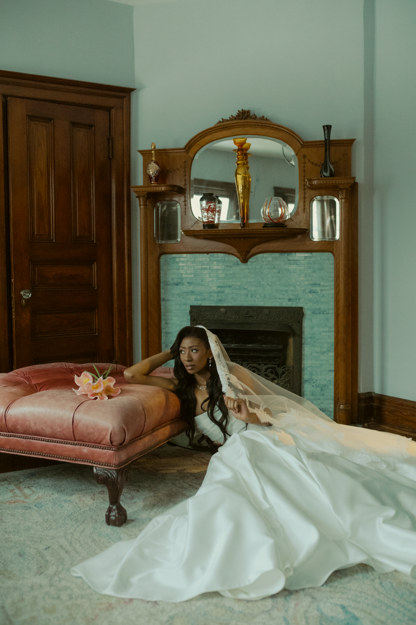 bride poses in a fancy Victorian mansion before her wedding ceremony