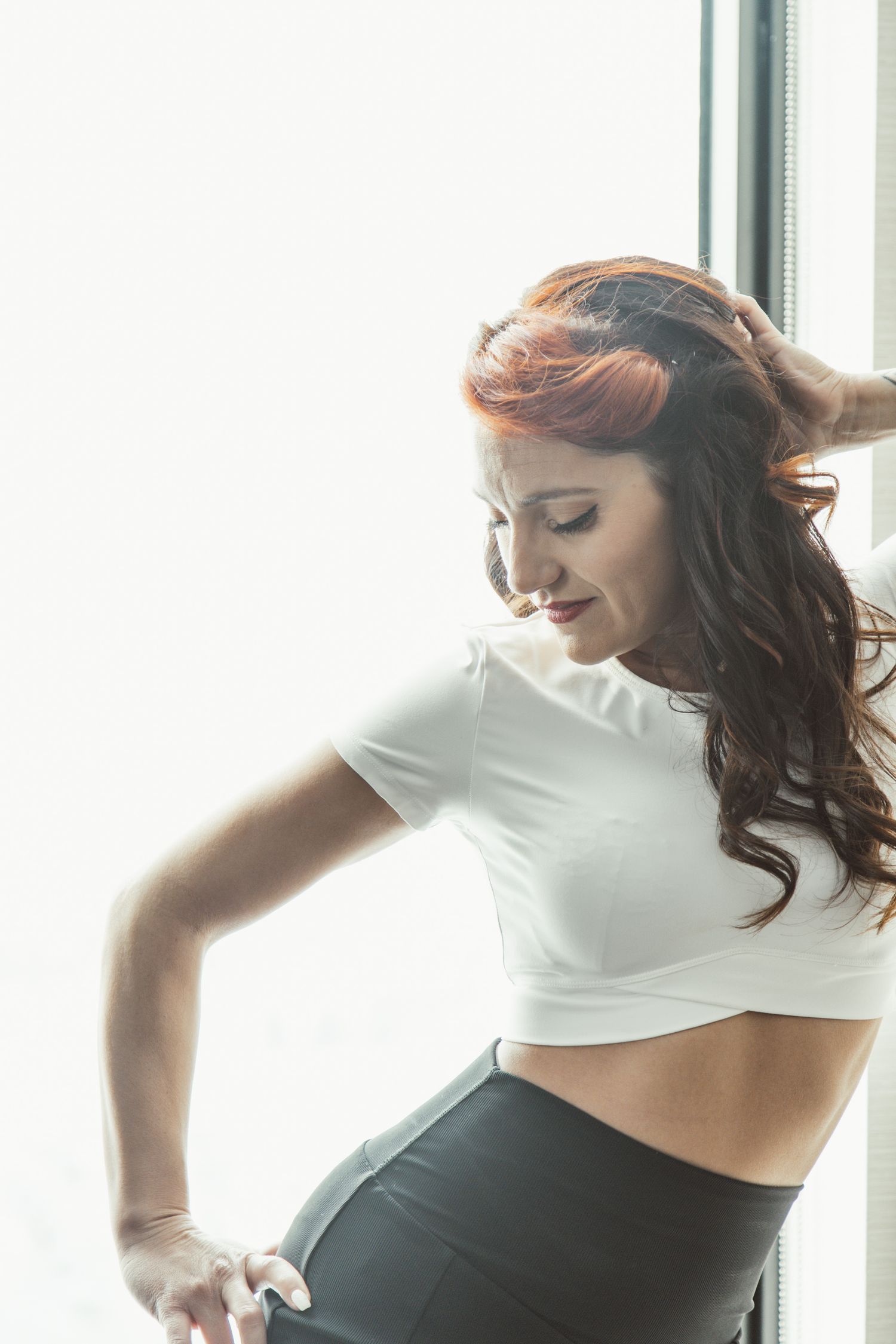 Expressive dance-like movements captured in a series of connected poses by a window.