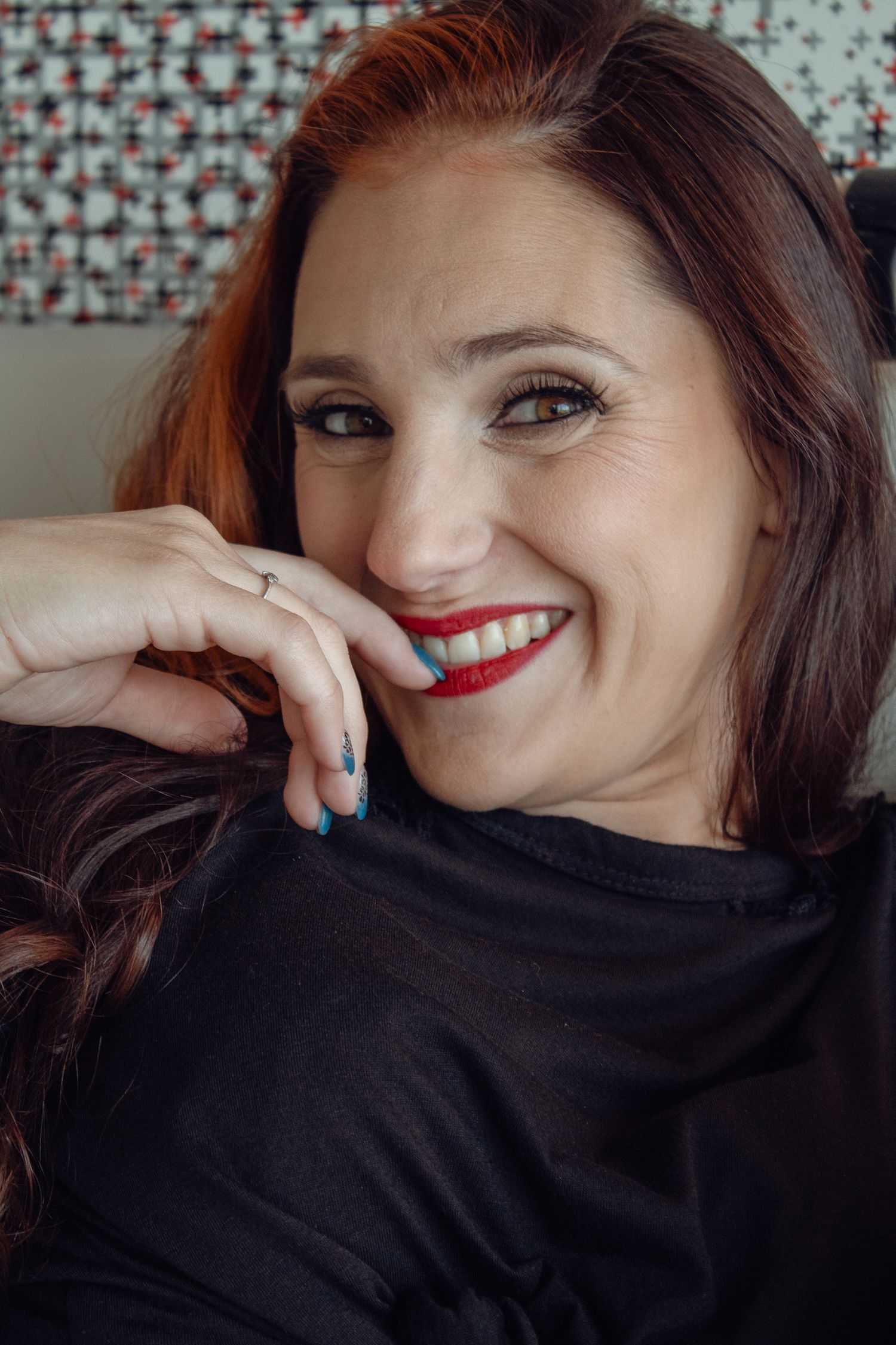 A series of close-up portraits showing joyful expressions and red lipstick against a patterned background.