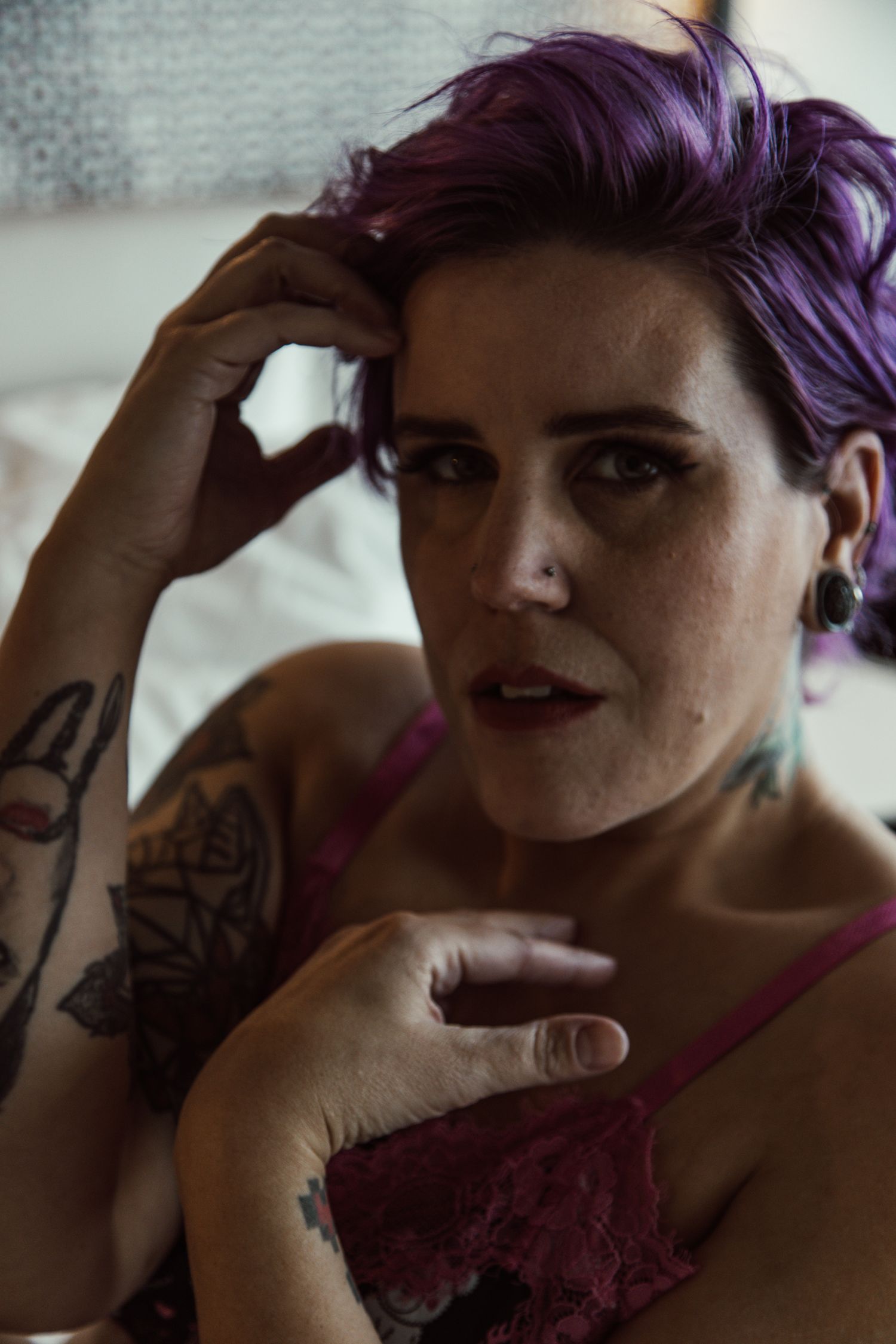 Artistic portrait series featuring purple hair and vintage-style makeup.