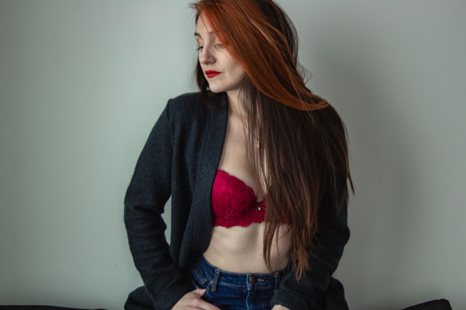 Fashion portraits showing dark blazer and red lingerie against neutral background.