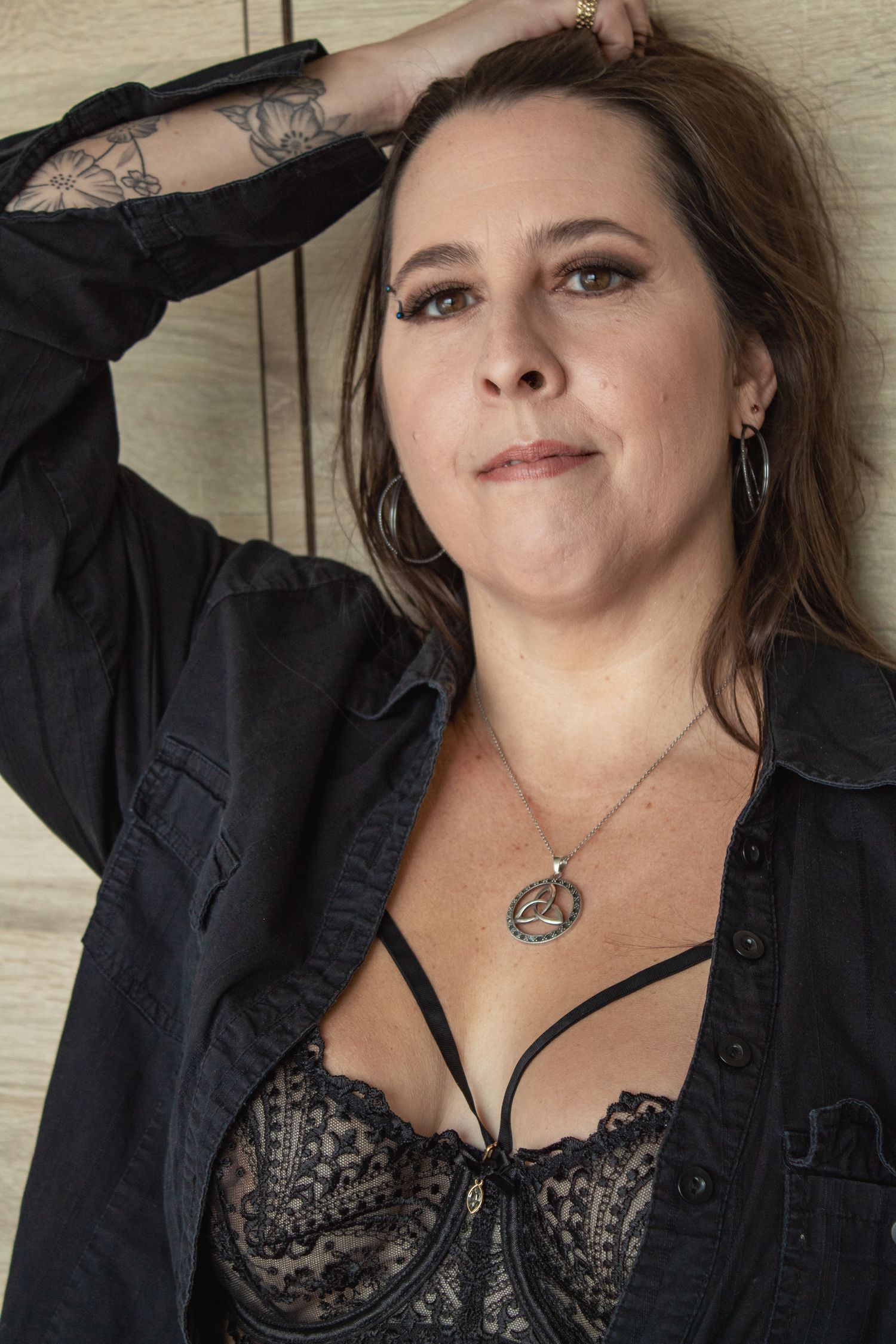Dramatic portrait series in black jacket showing confident poses.