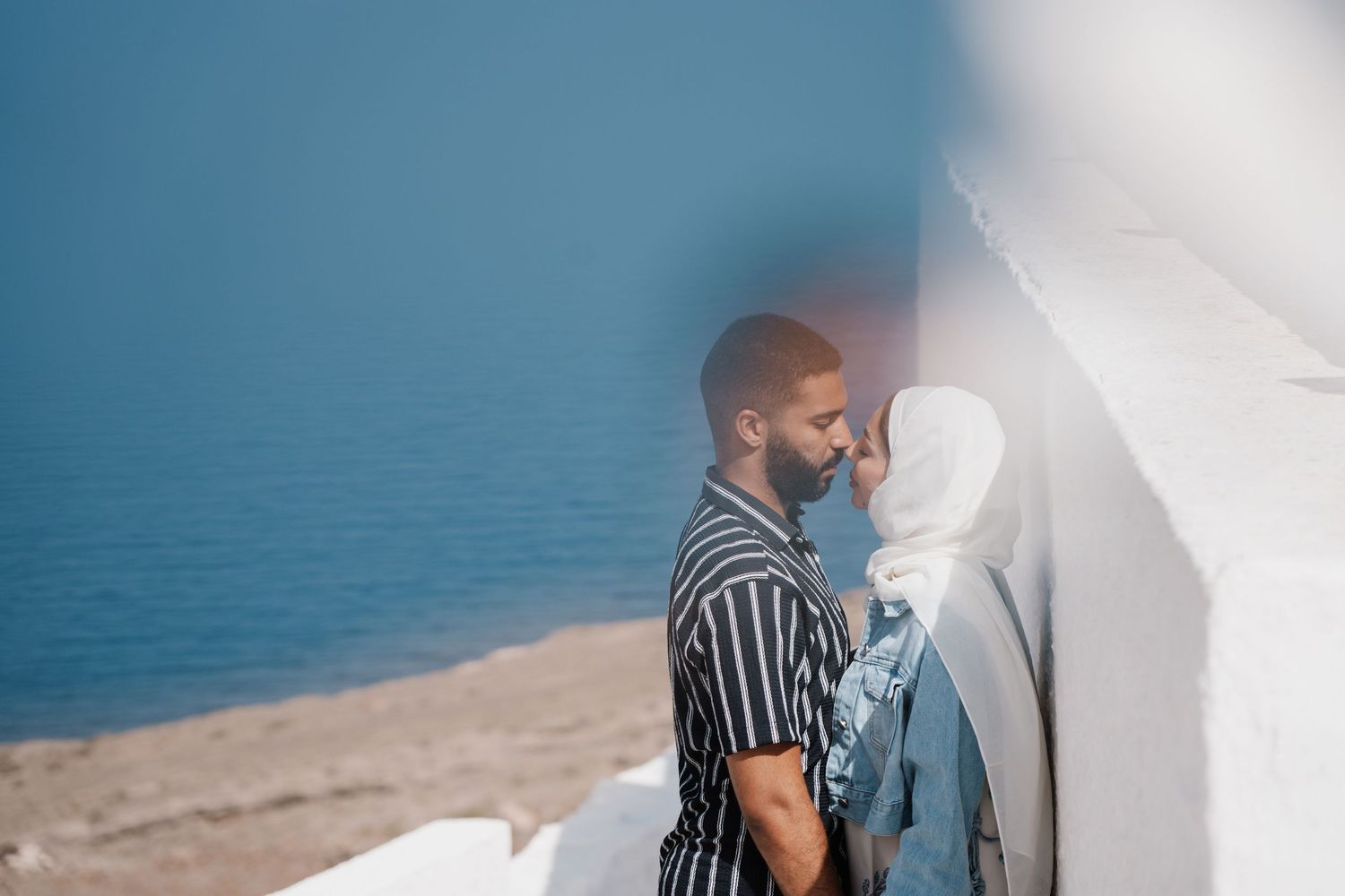 santorini photographer couple session oia sunset blue domes romantic photoshoot greece