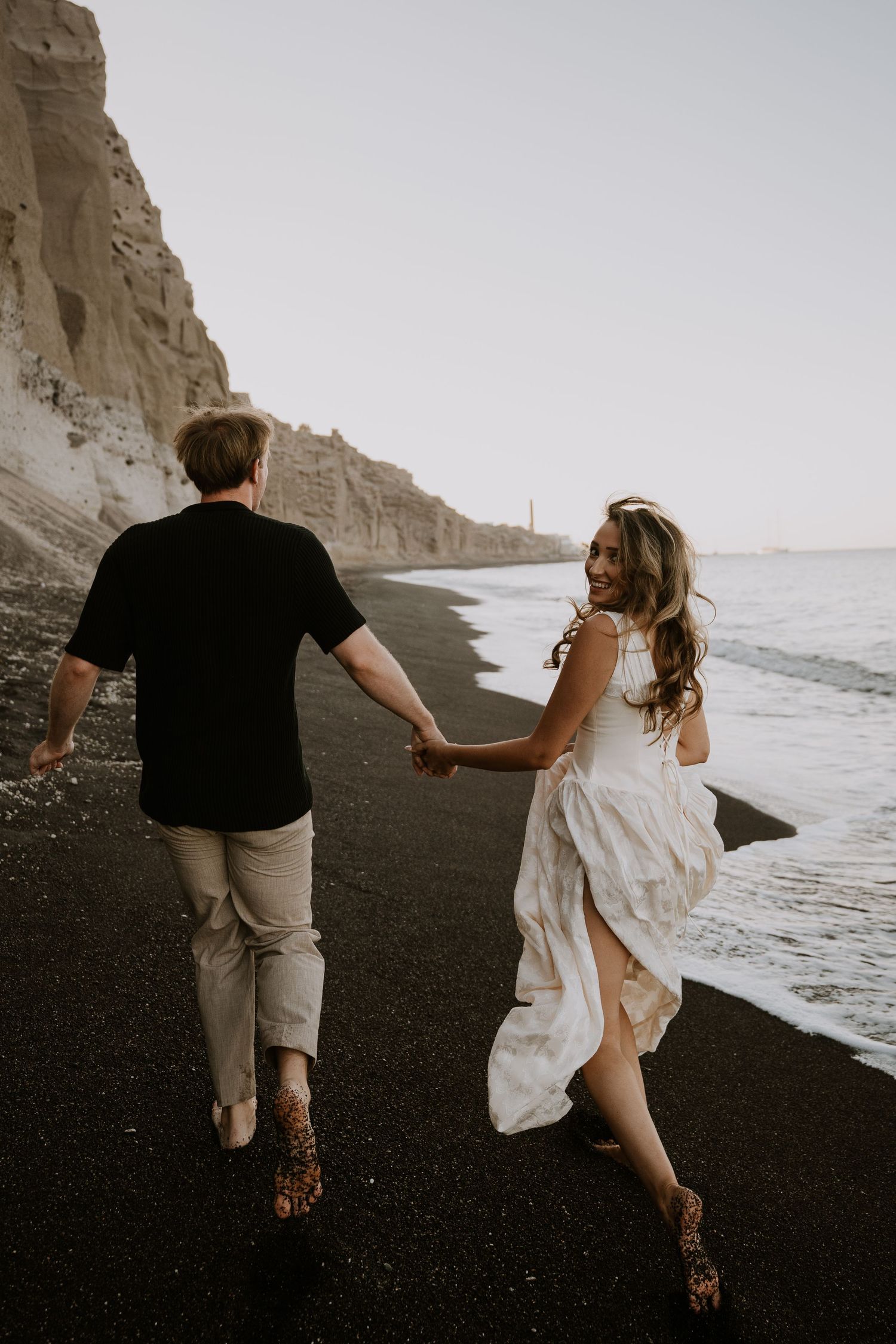 santorini photographer couple session oia sunset blue domes romantic photoshoot greece