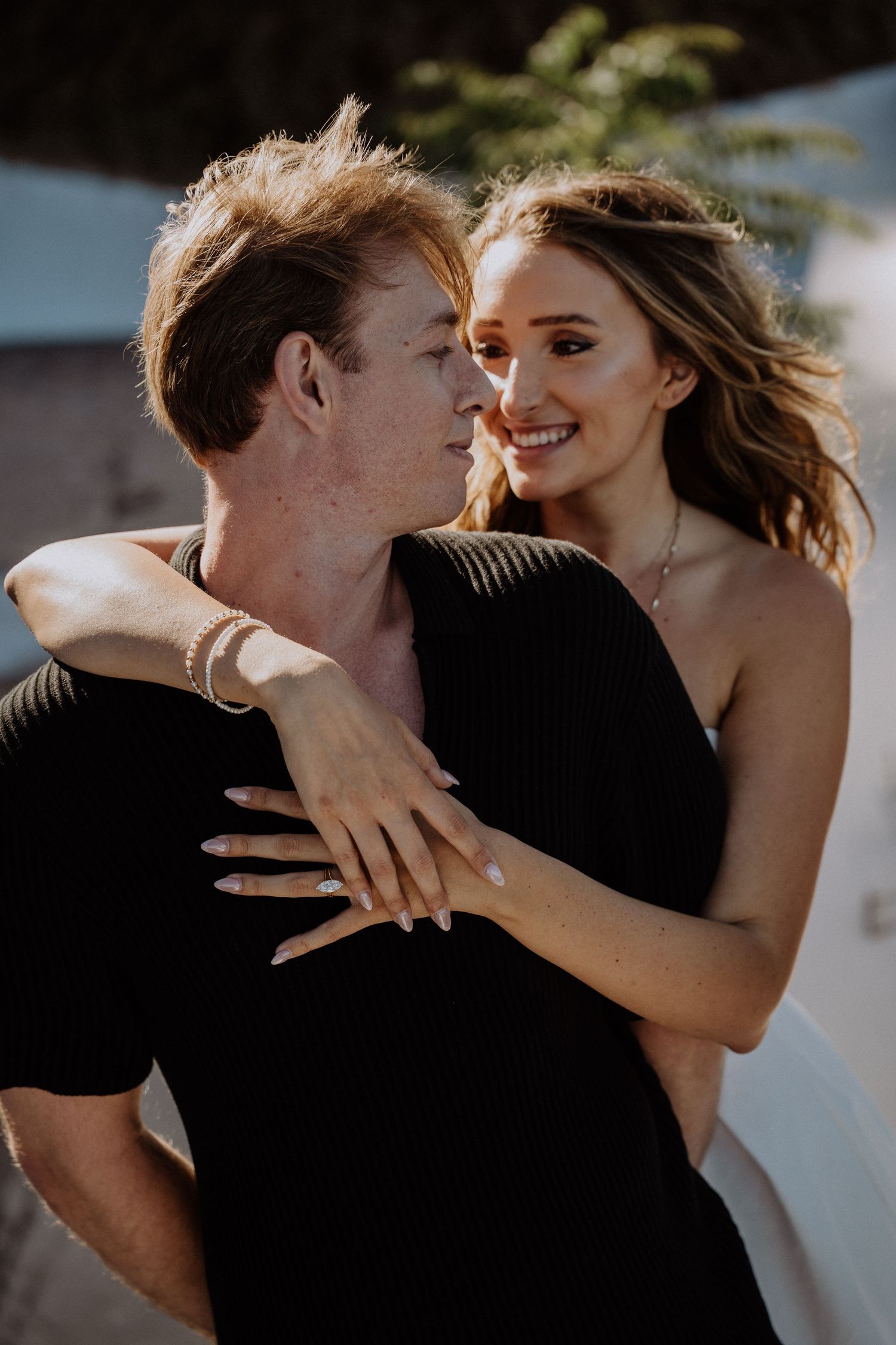 santorini photographer couple session oia sunset blue domes romantic photoshoot greece