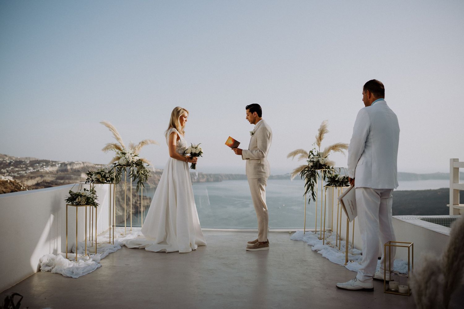 santorini wedding ceremony caldera view luxury destination wedding photographer santorini greece golden hour